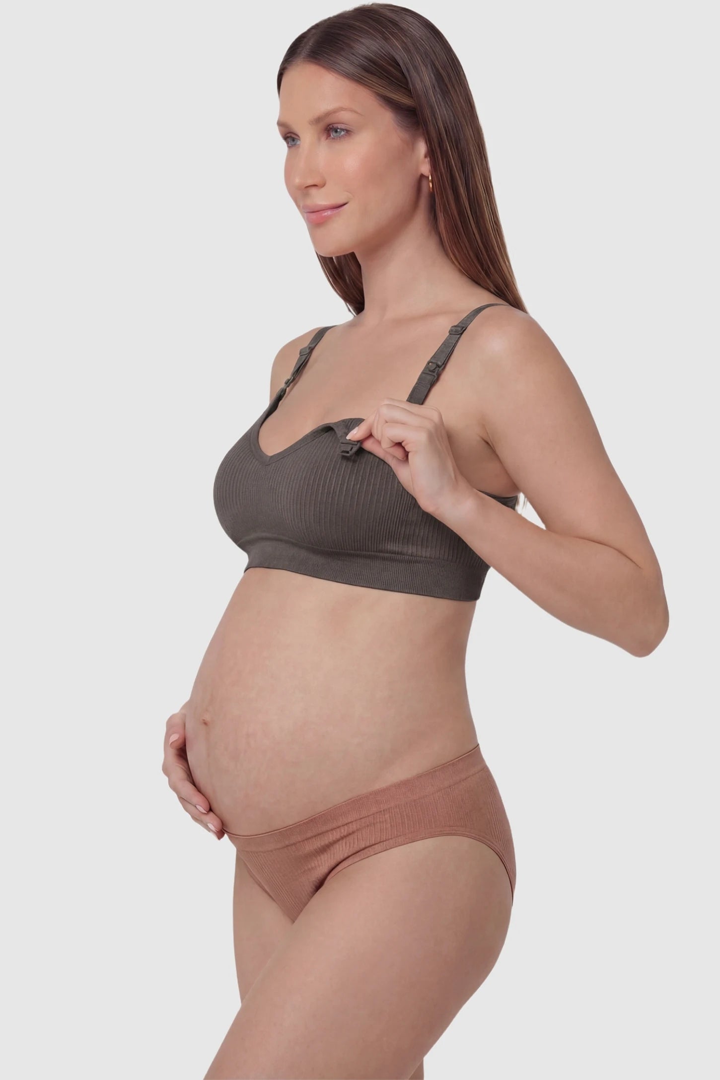 Ribbed Wireless Adjustable Shoulder Strap Nursing Bra Ribbed wireless adjustable strap nursing bra in coffee with front open clasp for breastfeeding, side view on pregnant model