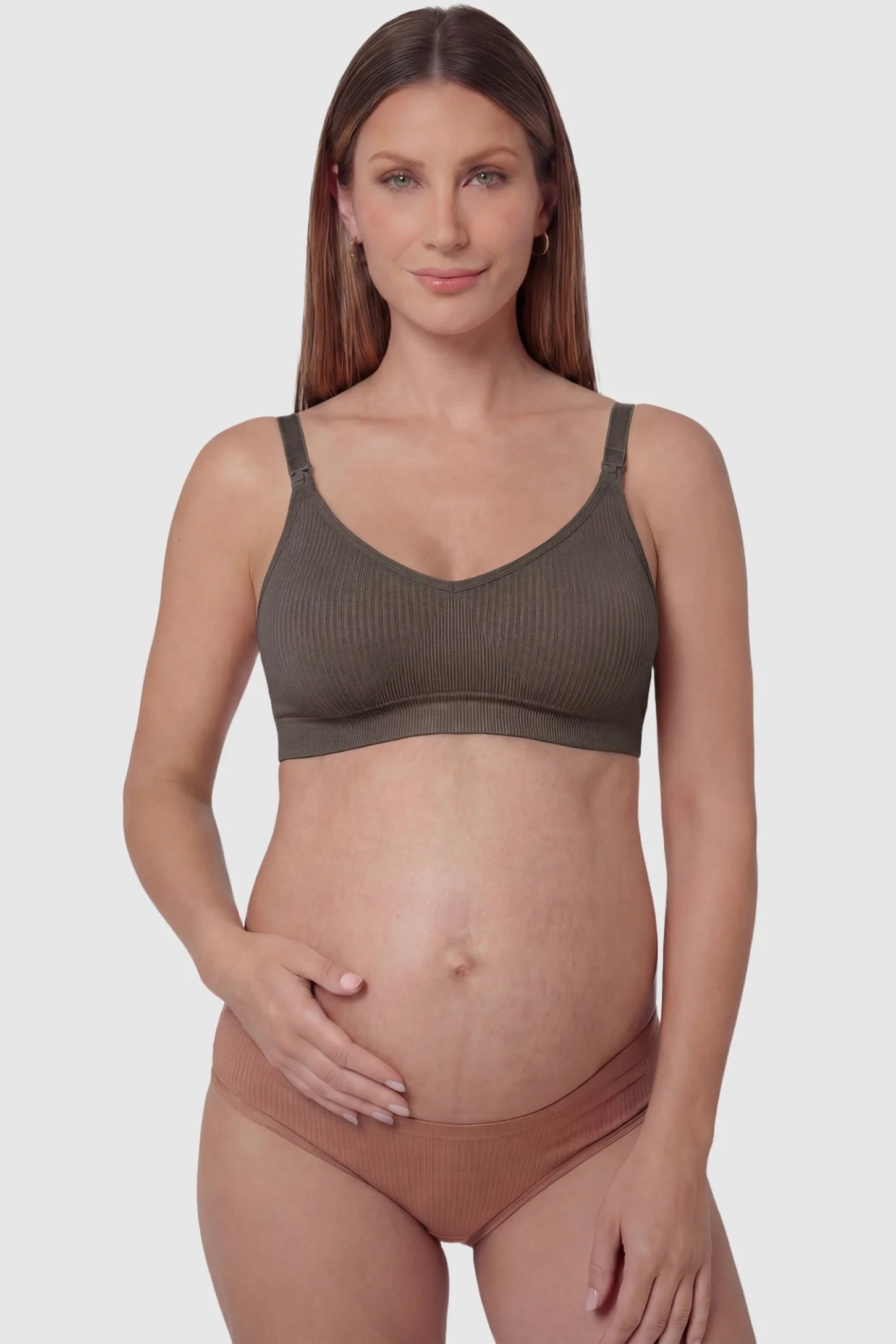 Ribbed Wireless Adjustable Shoulder Strap Nursing Bra Ribbed wireless adjustable strap nursing bra in coffee with front clasp, front view on pregnant model