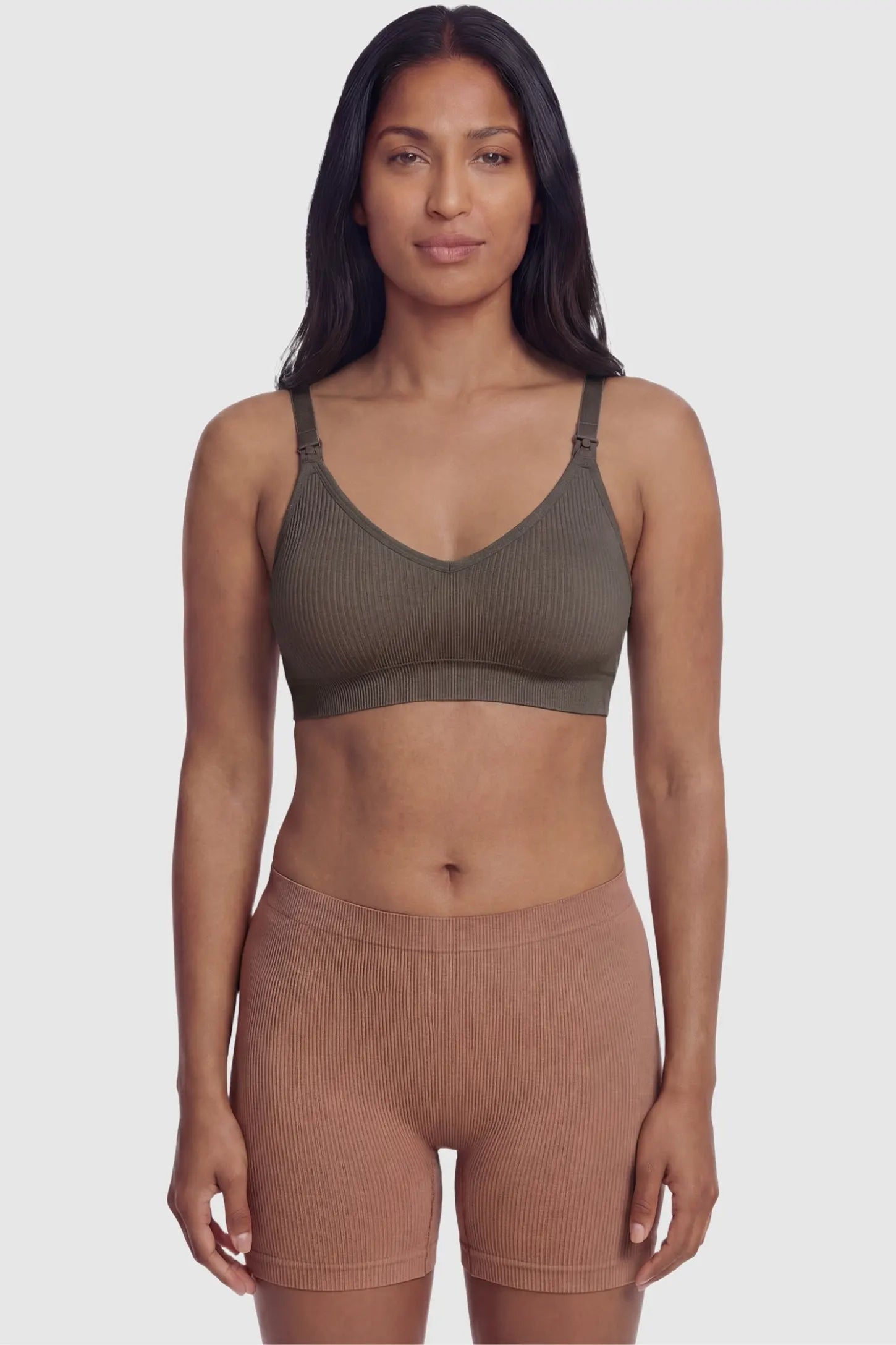 Ribbed Wireless Adjustable Shoulder Strap Nursing Bra Ribbed wireless adjustable strap nursing bra in coffee with stretchy fabric, front view on postpartum model