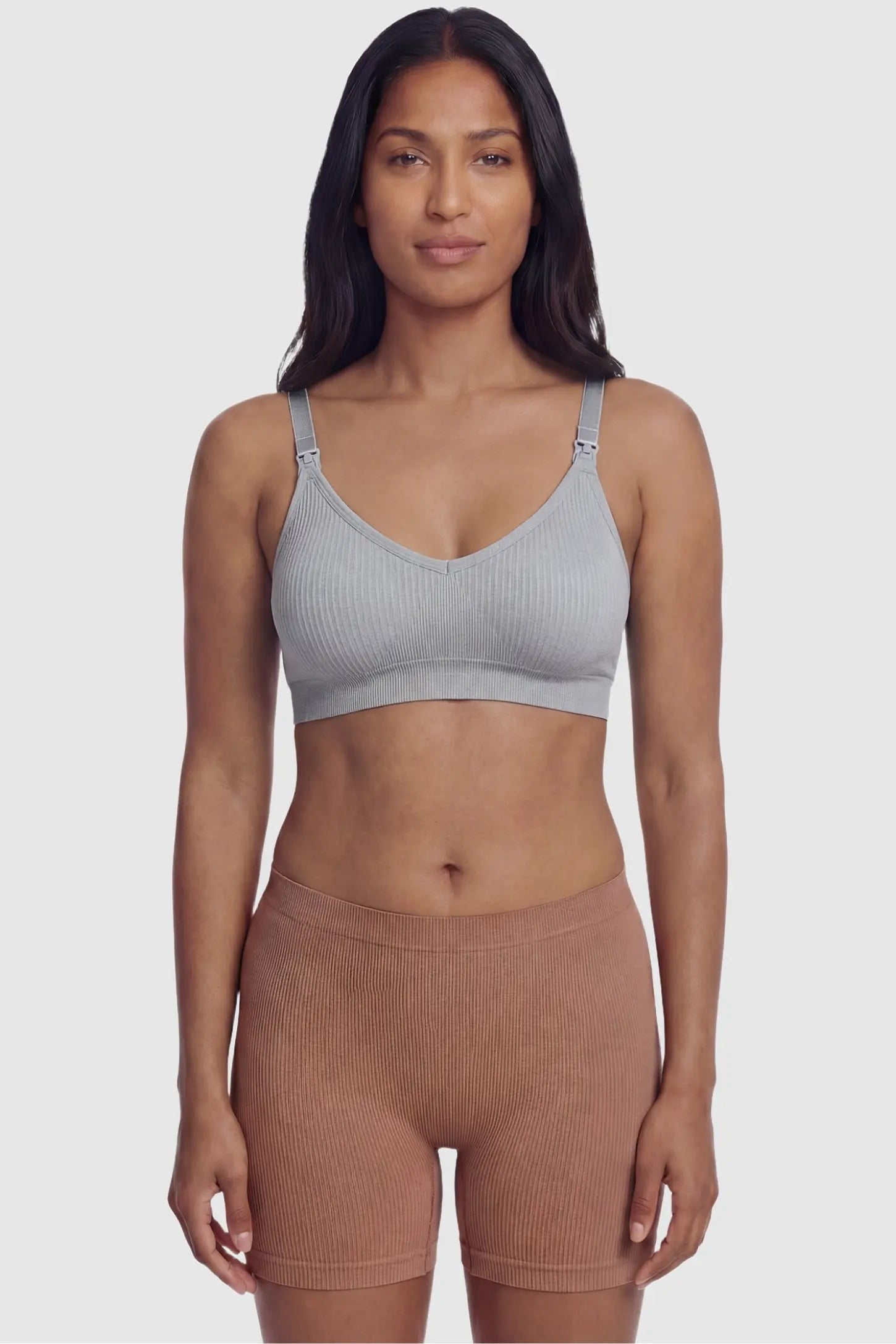Ribbed Wireless Adjustable Shoulder Strap Nursing Bra Ribbed wireless adjustable strap nursing bra in gray with stretchy fabric, front view on postpartum model
