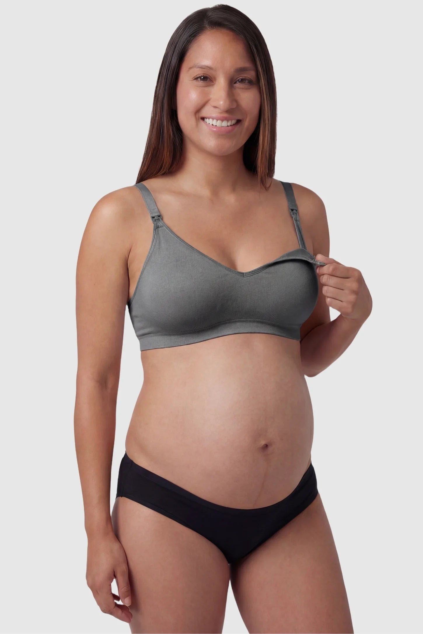 Seamless Front-Open Cross Wireless Nursing Bra Seamless front-open cross wireless nursing bra in gray with front nursing access, front view on pregnant model