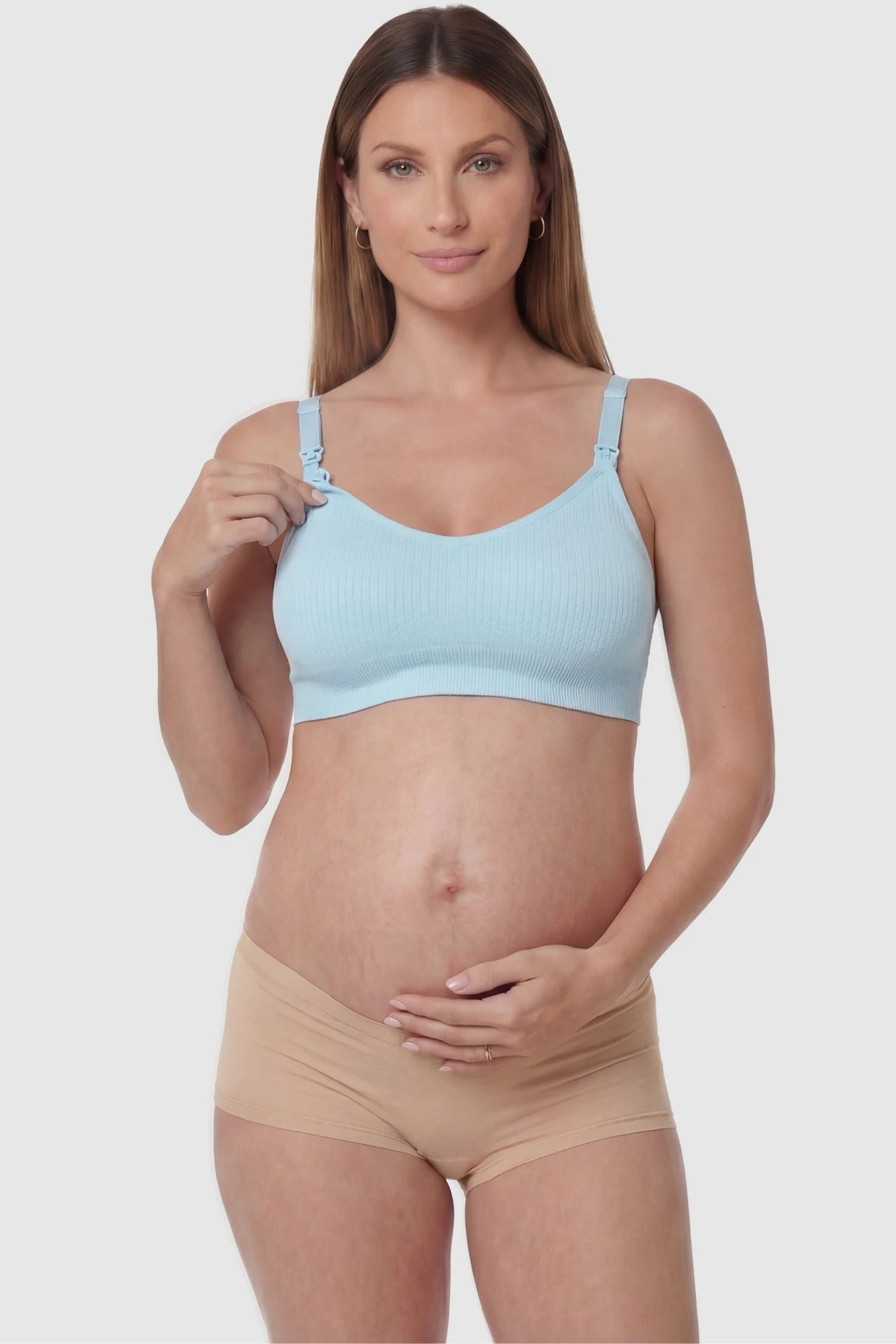 Full-Flap Seamless Top-Opening Nursing Bra Full-flap seamless top-opening nursing bra in light blue with one-hand access, front view on function demo model
