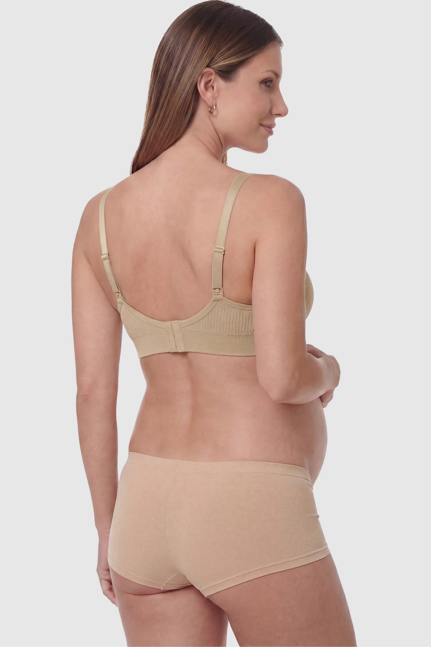 Full-Flap Seamless Top-Opening Nursing Bra Full-flap seamless top-opening nursing bra in light brown with invisible back buckle, back view on pregnant model