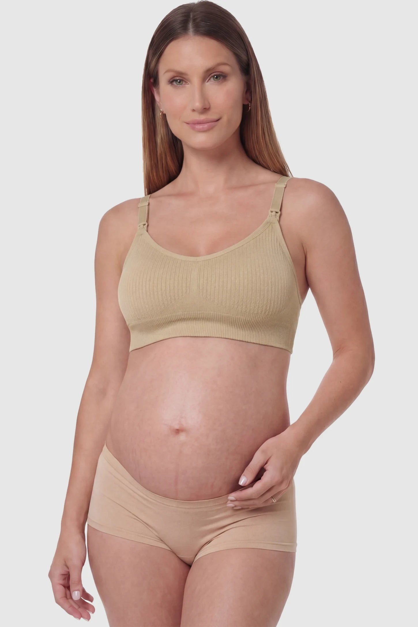 Full-Flap Seamless Top-Opening Nursing Bra Full-flap seamless top-opening nursing bra in light brown with 3D support, front view on pregnant model