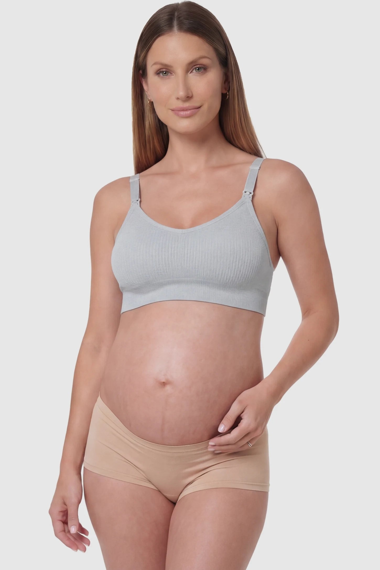Full-Flap Seamless Top-Opening Nursing Bra Full-flap seamless top-opening nursing bra in light gray with 3D support, front view on pregnant model