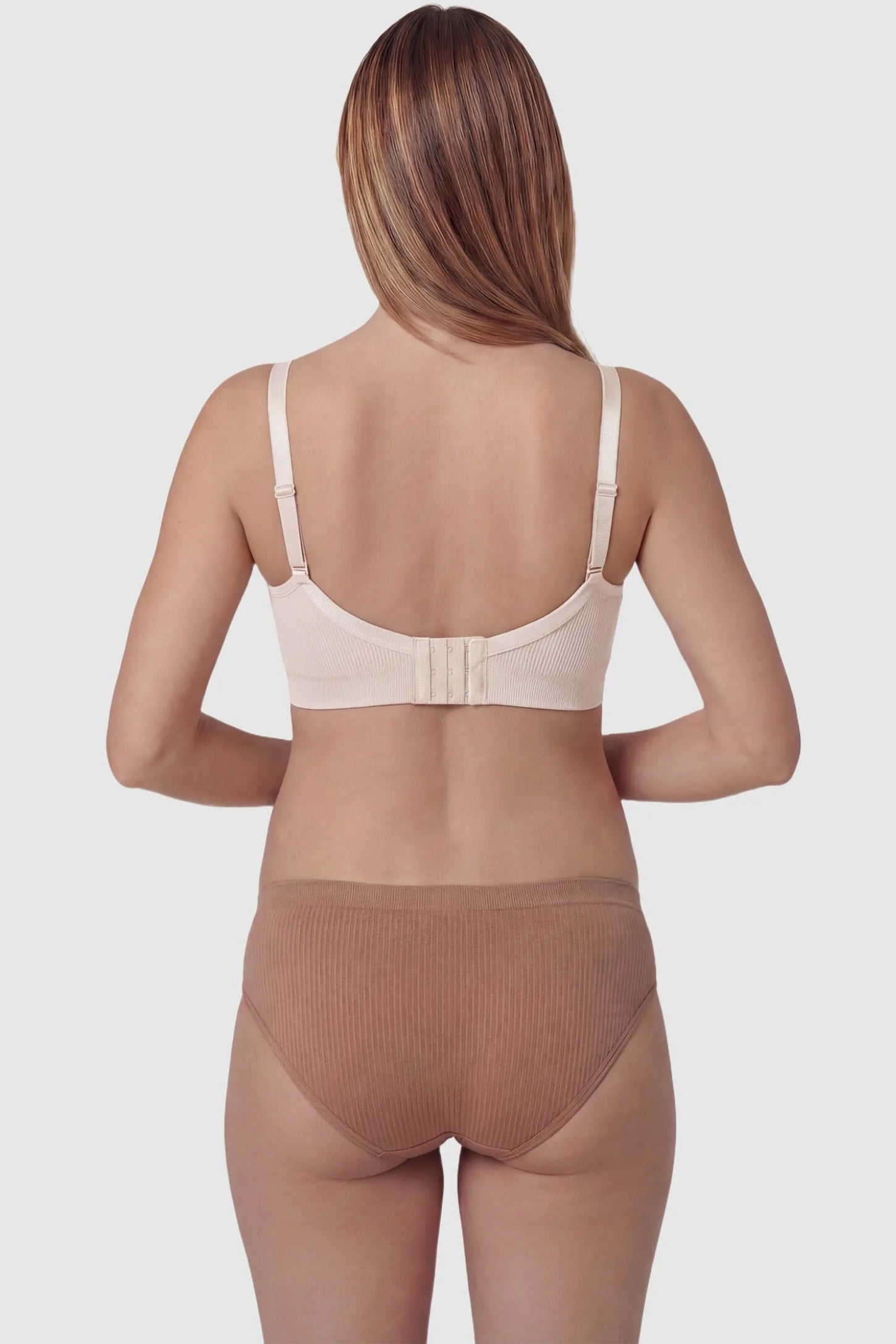 Ribbed Wireless Adjustable Shoulder Strap Nursing Bra Ribbed wireless adjustable strap nursing bra in pink with wire-free support, back view on pregnant model
