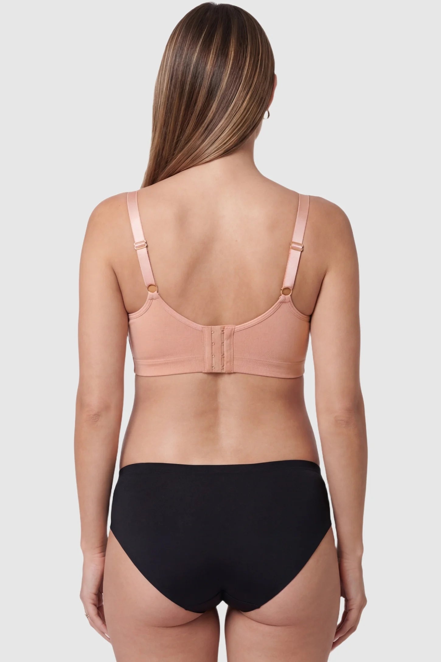 Embroidered lace wire-free front-open nursing bra in pink with adjustable hook closure, back view on pregnant model