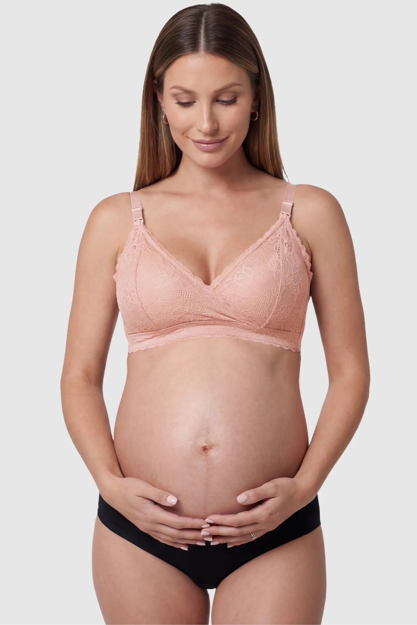 Embroidered lace wire-free front-open nursing bra in pink with breathable lace, front view on pregnant model