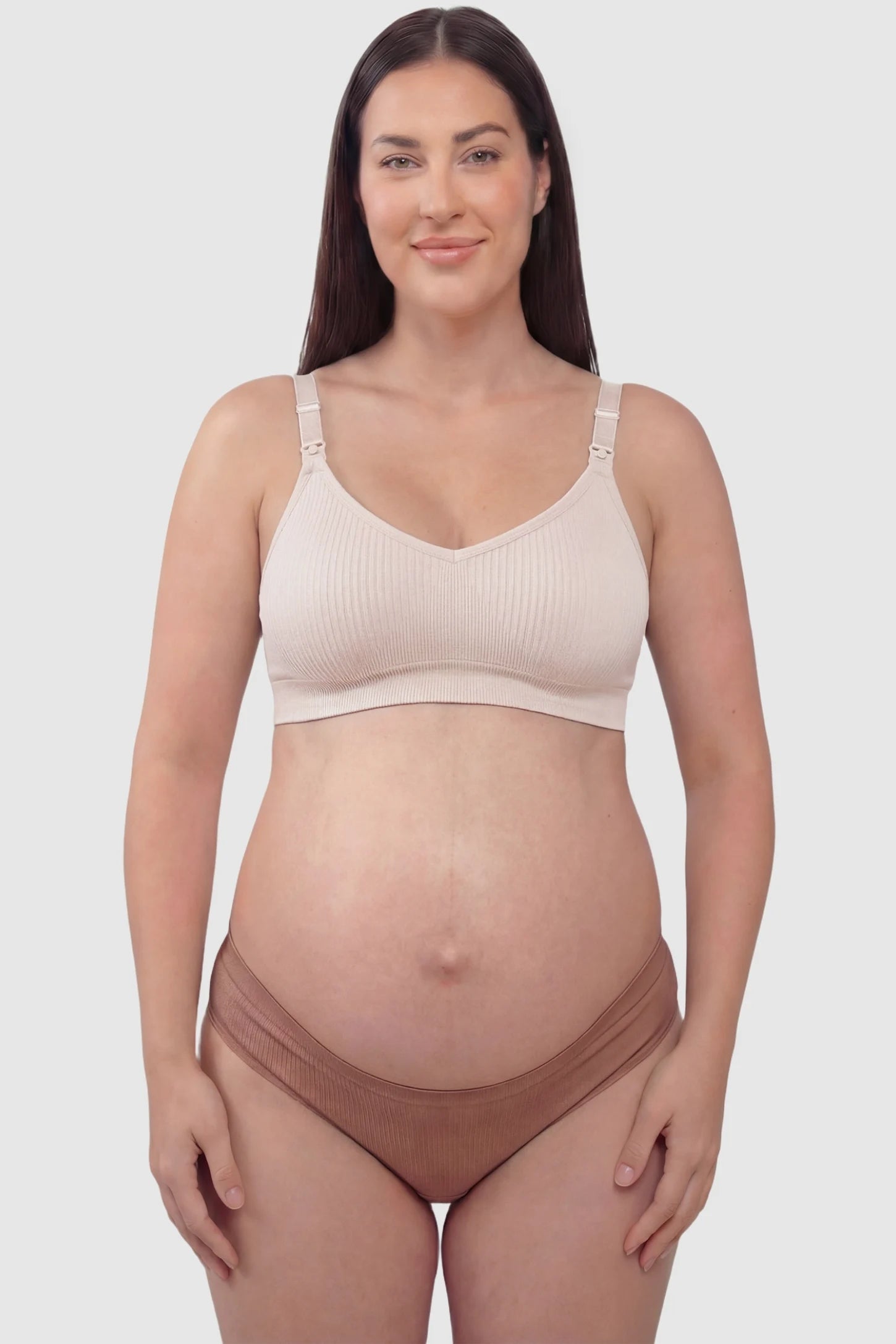 Ribbed Wireless Adjustable Shoulder Strap Nursing Bra Ribbed wireless adjustable strap nursing bra in pink with stretchy fabric, front view on plus-size model