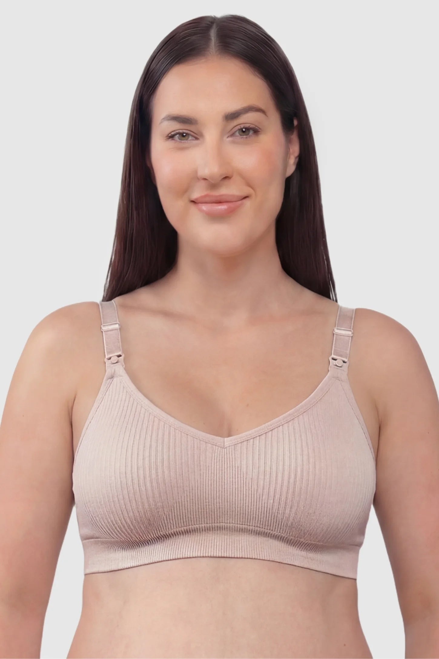 Ribbed Wireless Adjustable Shoulder Strap Nursing Bra Ribbed wireless adjustable strap nursing bra in pink with stretchy fabric, front view on plus-size model