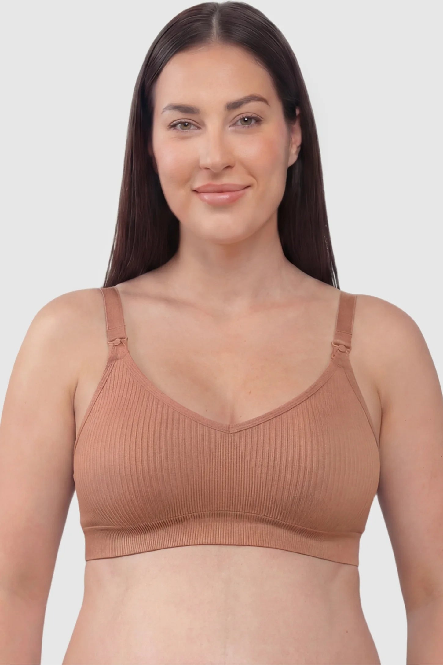 Ribbed Wireless Adjustable Shoulder Strap Nursing Bra Ribbed wireless adjustable strap nursing bra in shrimp red with stretchy fabric, front view on plus-size model