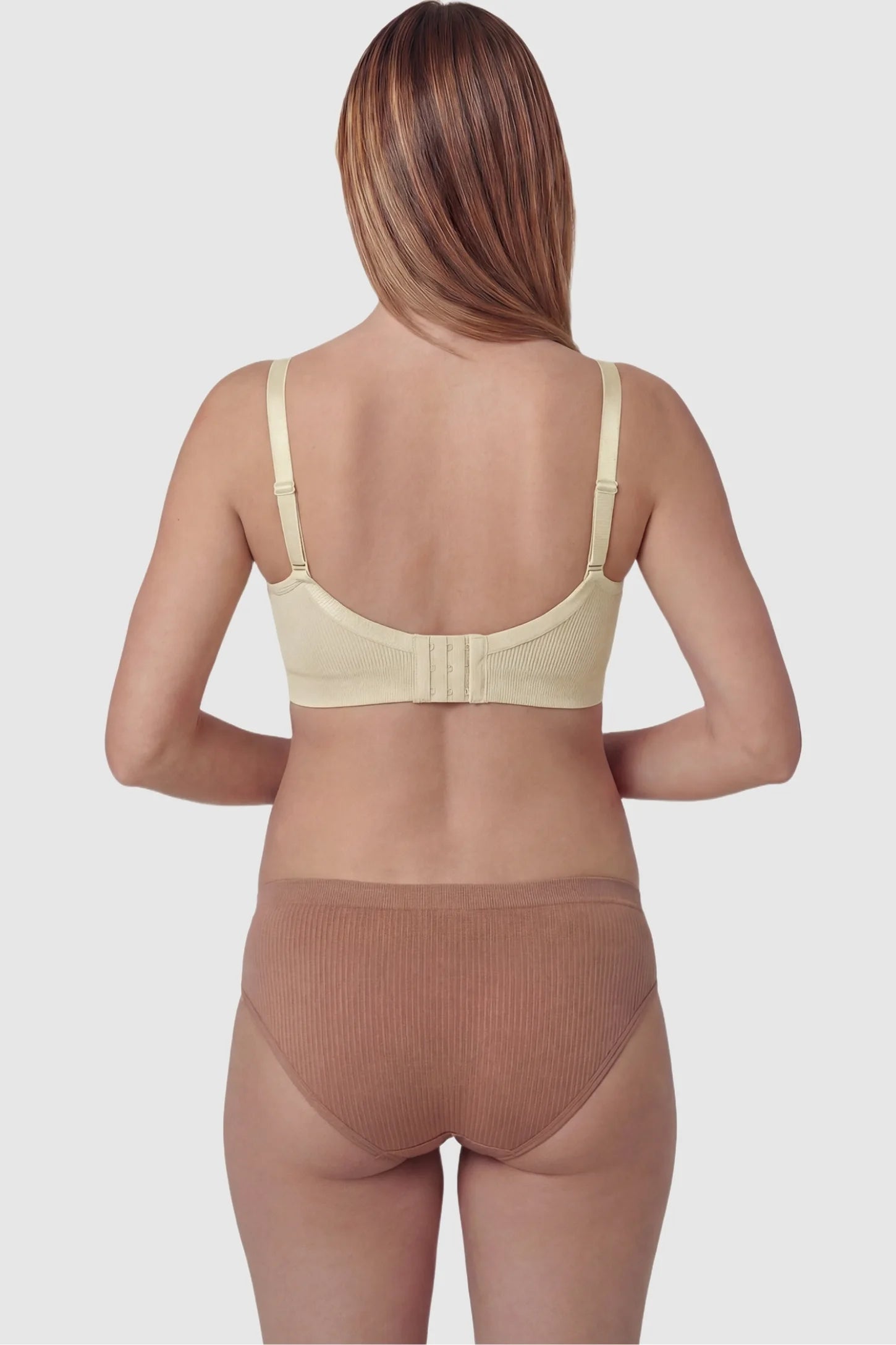 Ribbed Wireless Adjustable Shoulder Strap Nursing Bra Ribbed wireless adjustable strap nursing bra in skin with wire-free support, back view on pregnant model