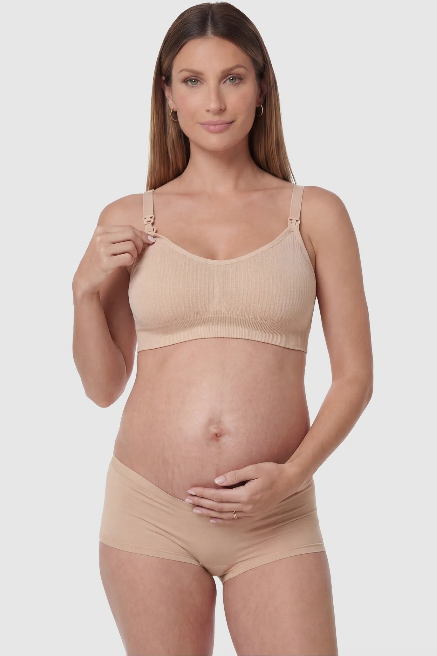 Full-Flap Seamless Top-Opening Nursing Bra Full-flap seamless top-opening nursing bra in skin color with one-hand access, front view on function demo model
