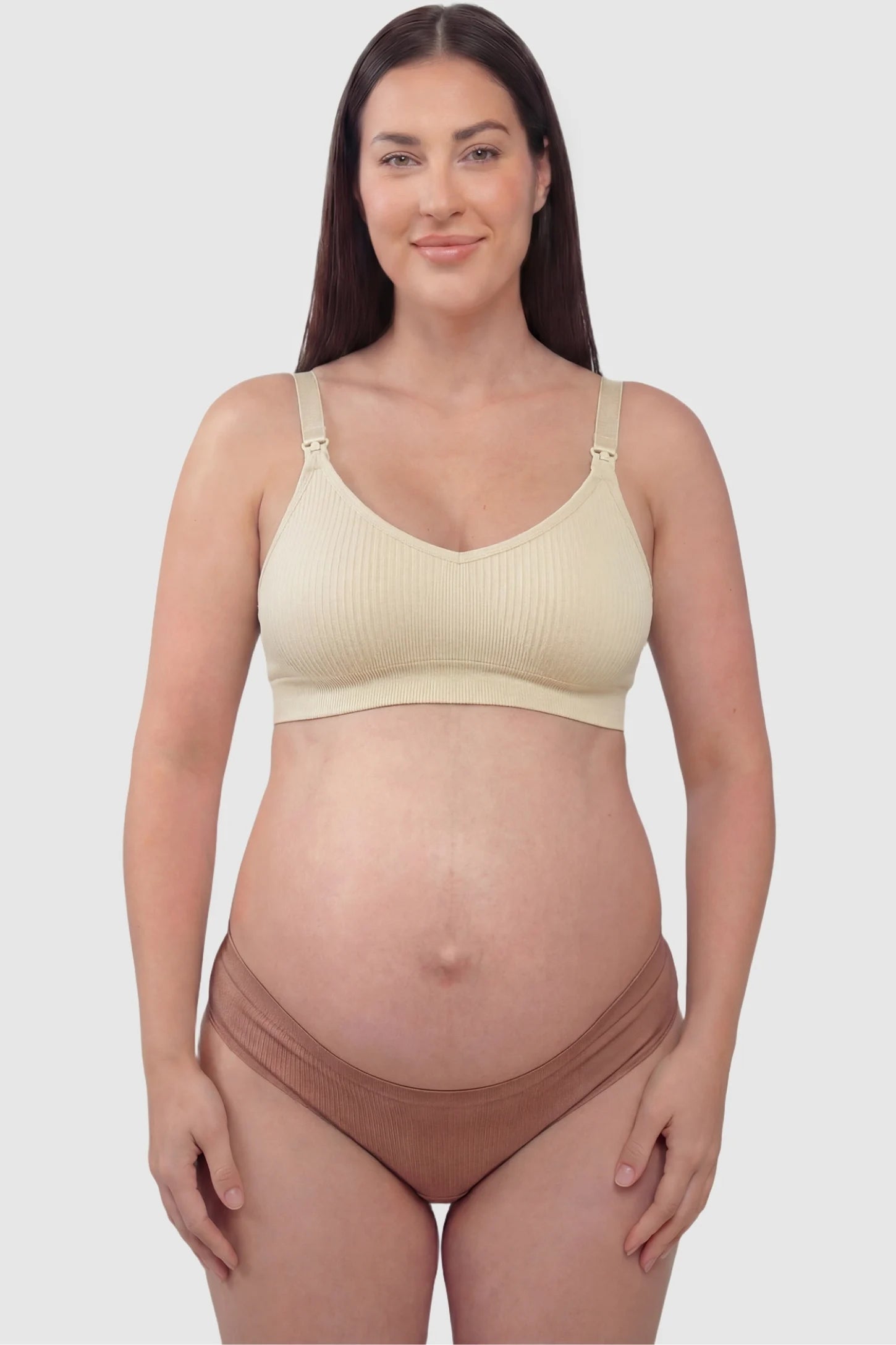 Ribbed Wireless Adjustable Shoulder Strap Nursing Bra Ribbed wireless adjustable strap nursing bra in skin with stretchy fabric, front view on plus-size model