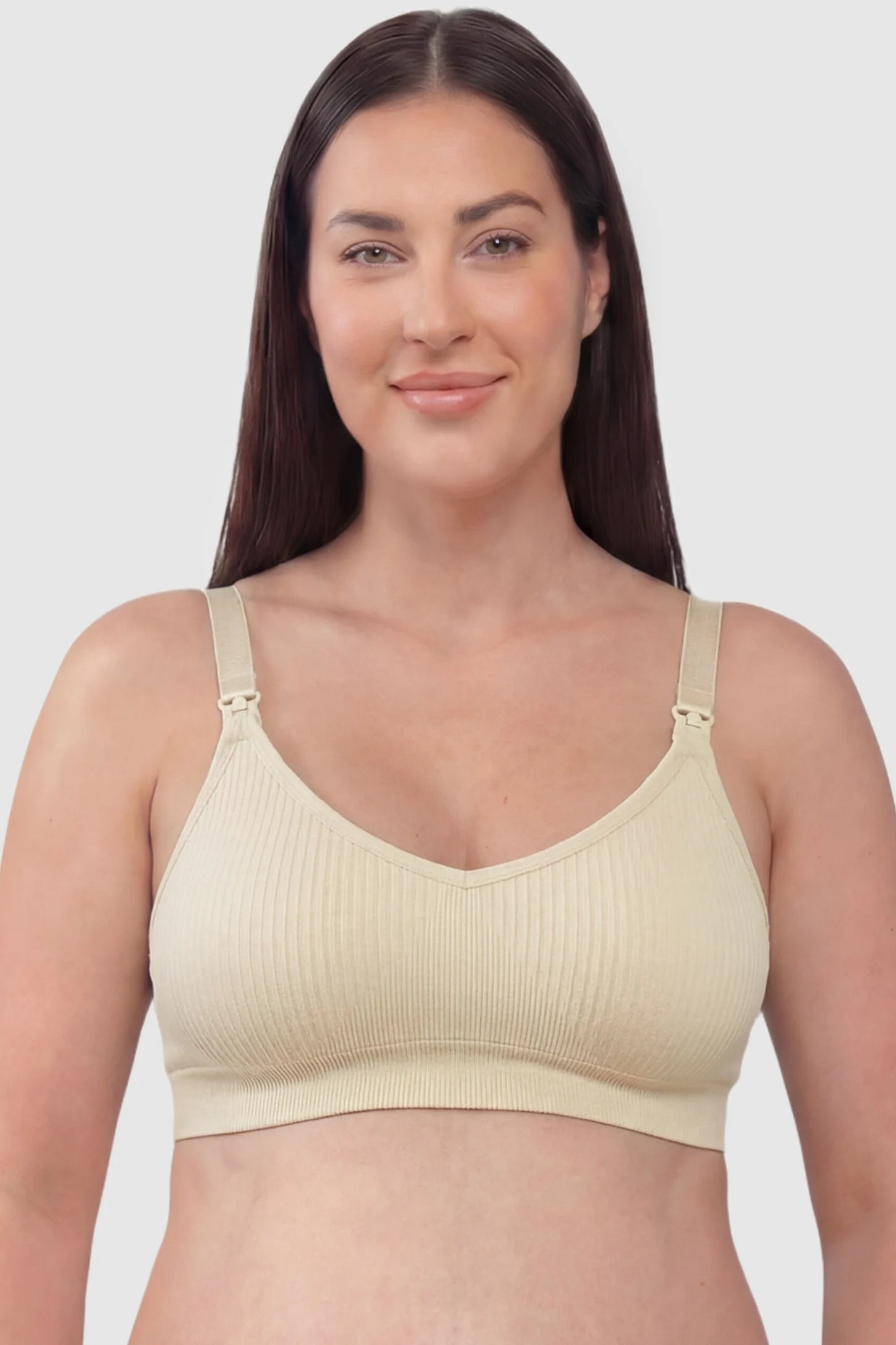 Ribbed Wireless Adjustable Shoulder Strap Nursing Bra Ribbed wireless adjustable strap nursing bra in skin with stretchy fabric, front view on plus-size model