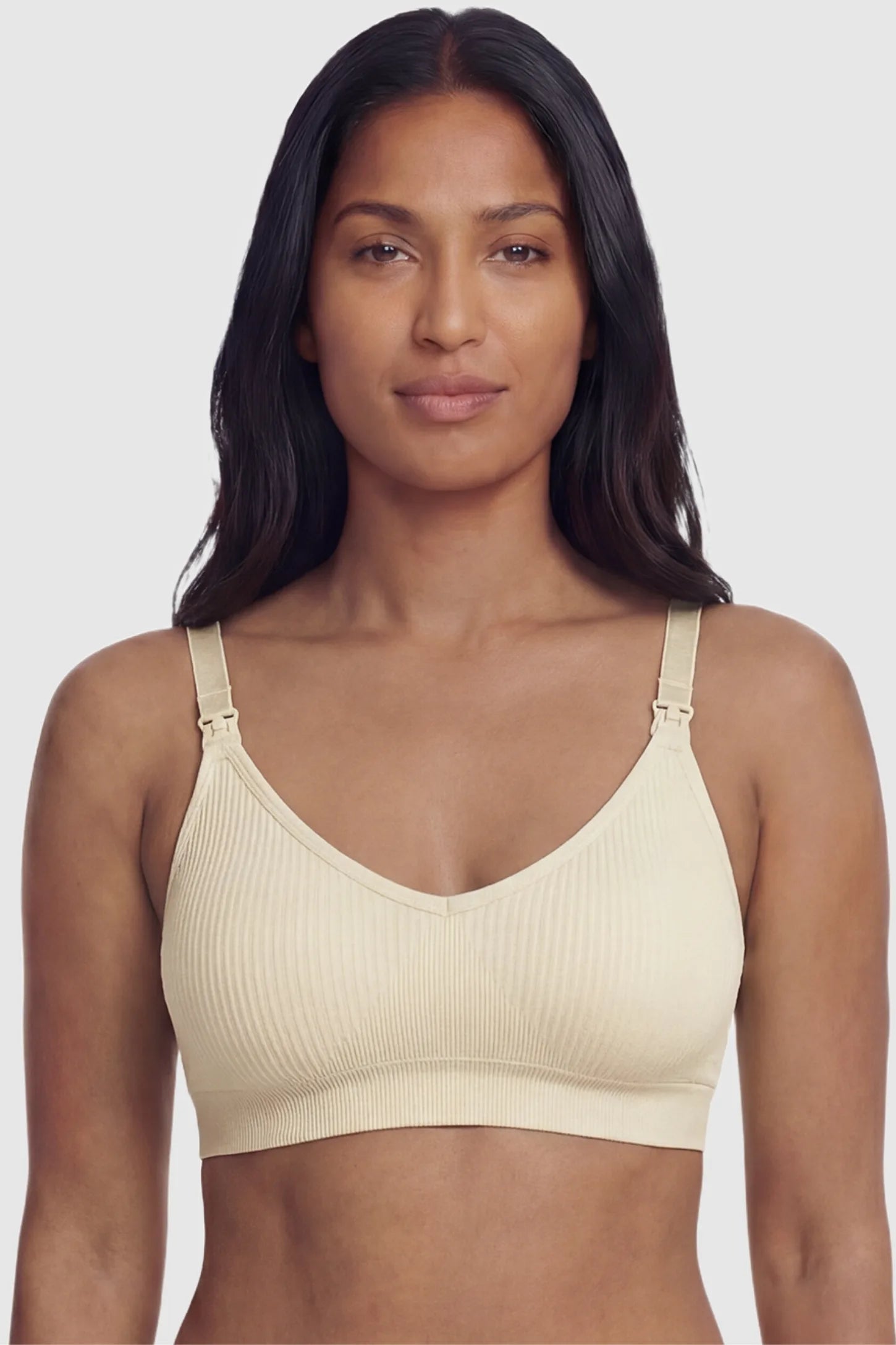 Ribbed Wireless Adjustable Shoulder Strap Nursing Bra Ribbed wireless adjustable strap nursing bra in skin with stretchy fabric, front view on postpartum model