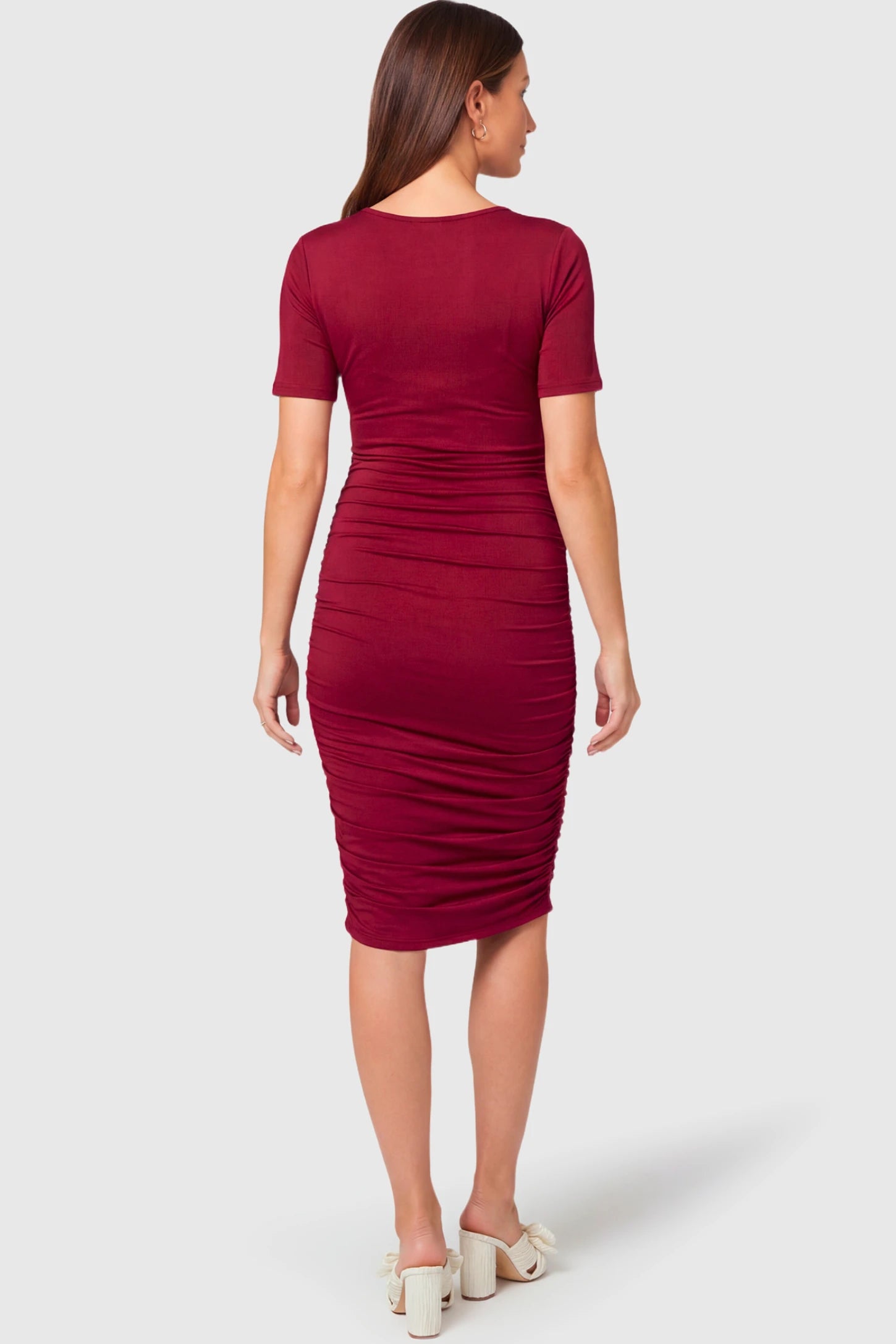 Crew Neck Bodycon Maternity & Nursing Midi Dress Crew Neck Bodycon Maternity & Nursing Midi Dress in wine red featuring  short sleeves on a  pregnant model.