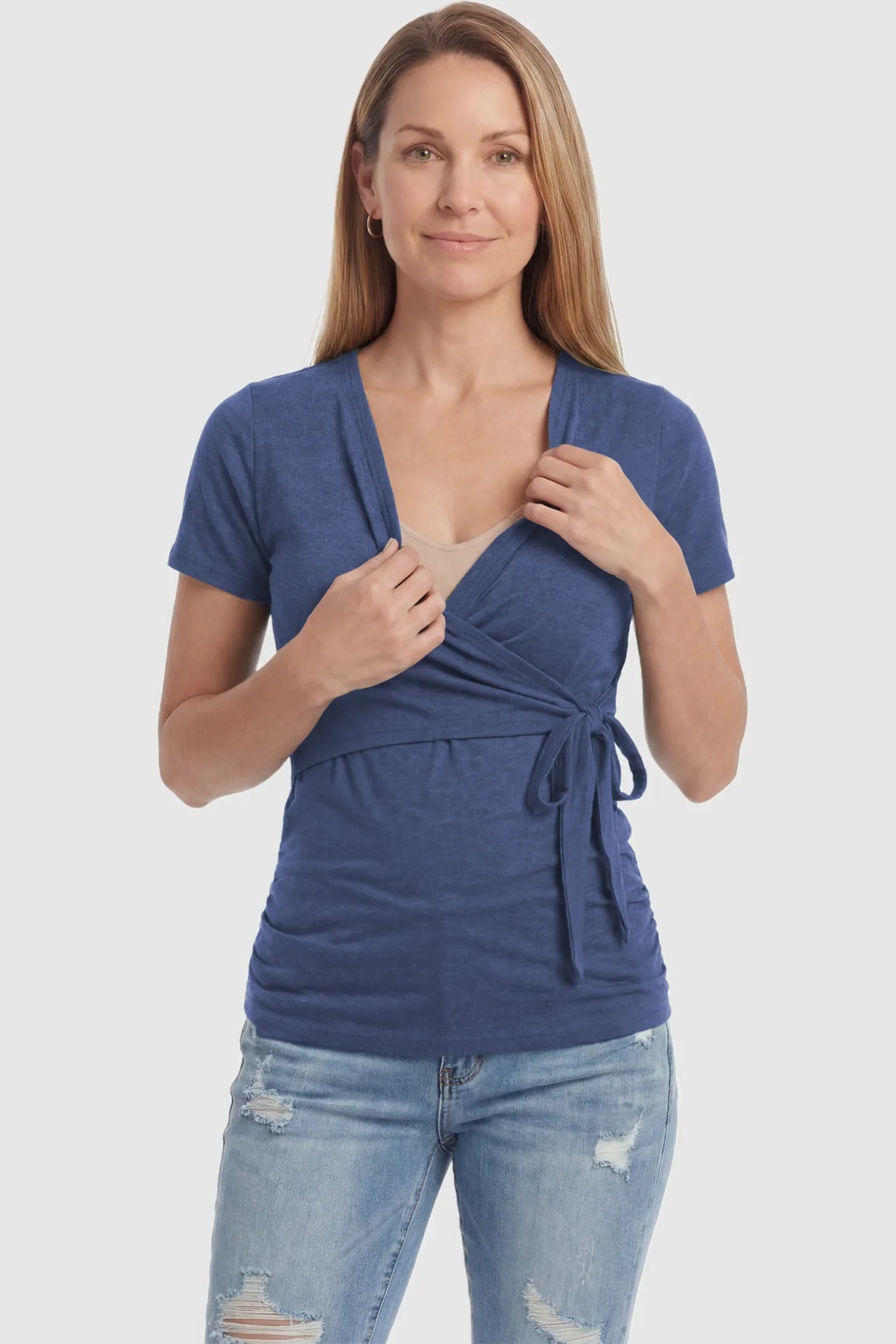 Nursing Access V-Neck Wrap Maternity & Nursing Top Nursing access V-neck wrap maternity and nursing top in blue with easy nursing access design, front view on postpartum model