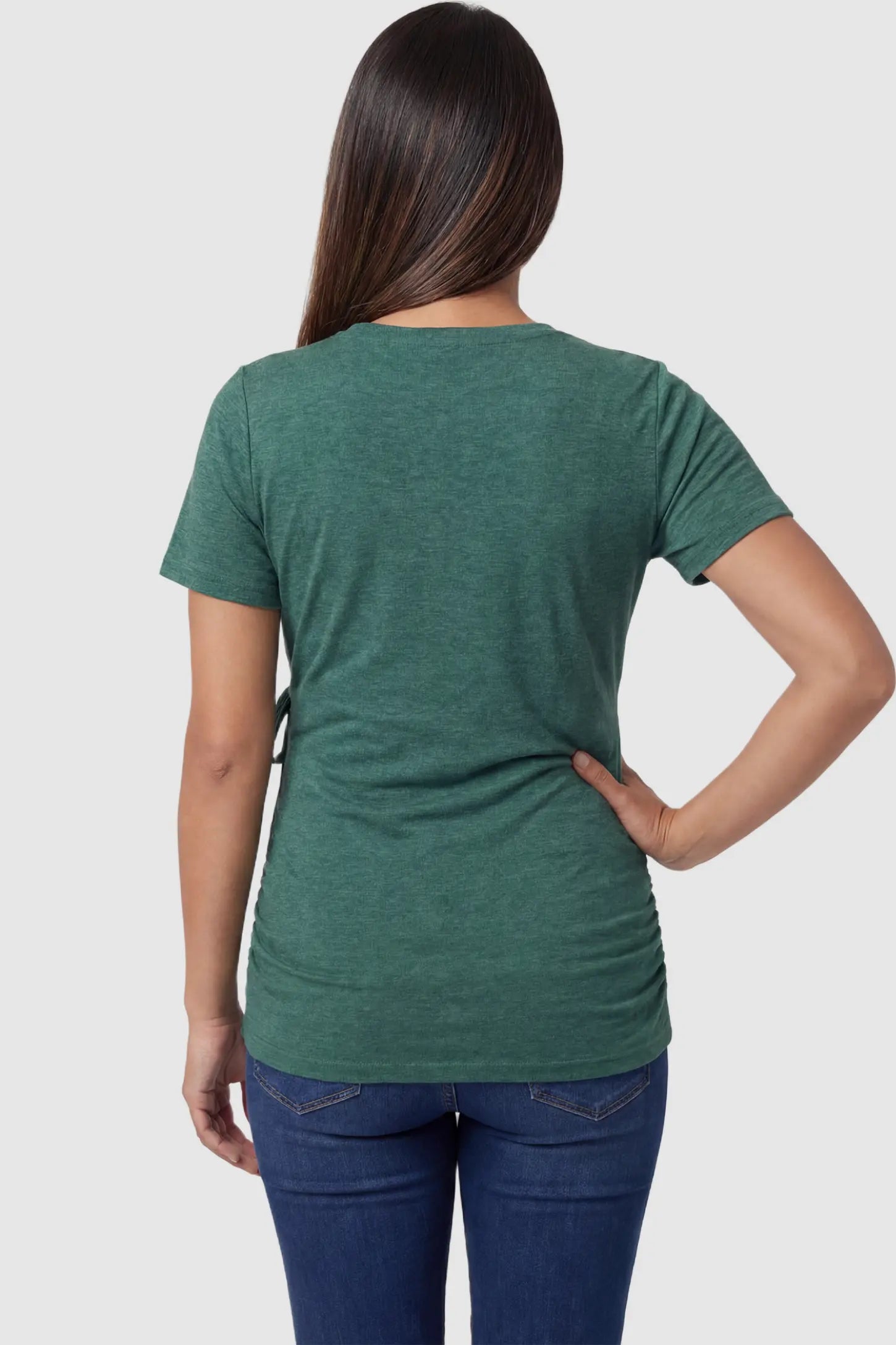 Nursing Access V-Neck Wrap Maternity & Nursing Top Nursing access V-neck wrap maternity and nursing top in green with short sleeves, back view on pregnant model