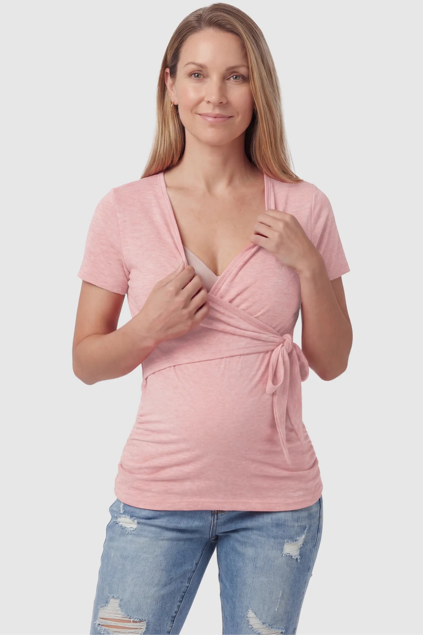 Nursing Access V-Neck Wrap Maternity & Nursing Top Nursing access V-neck wrap maternity and nursing top in pink with easy nursing access design, front view on postpartum model