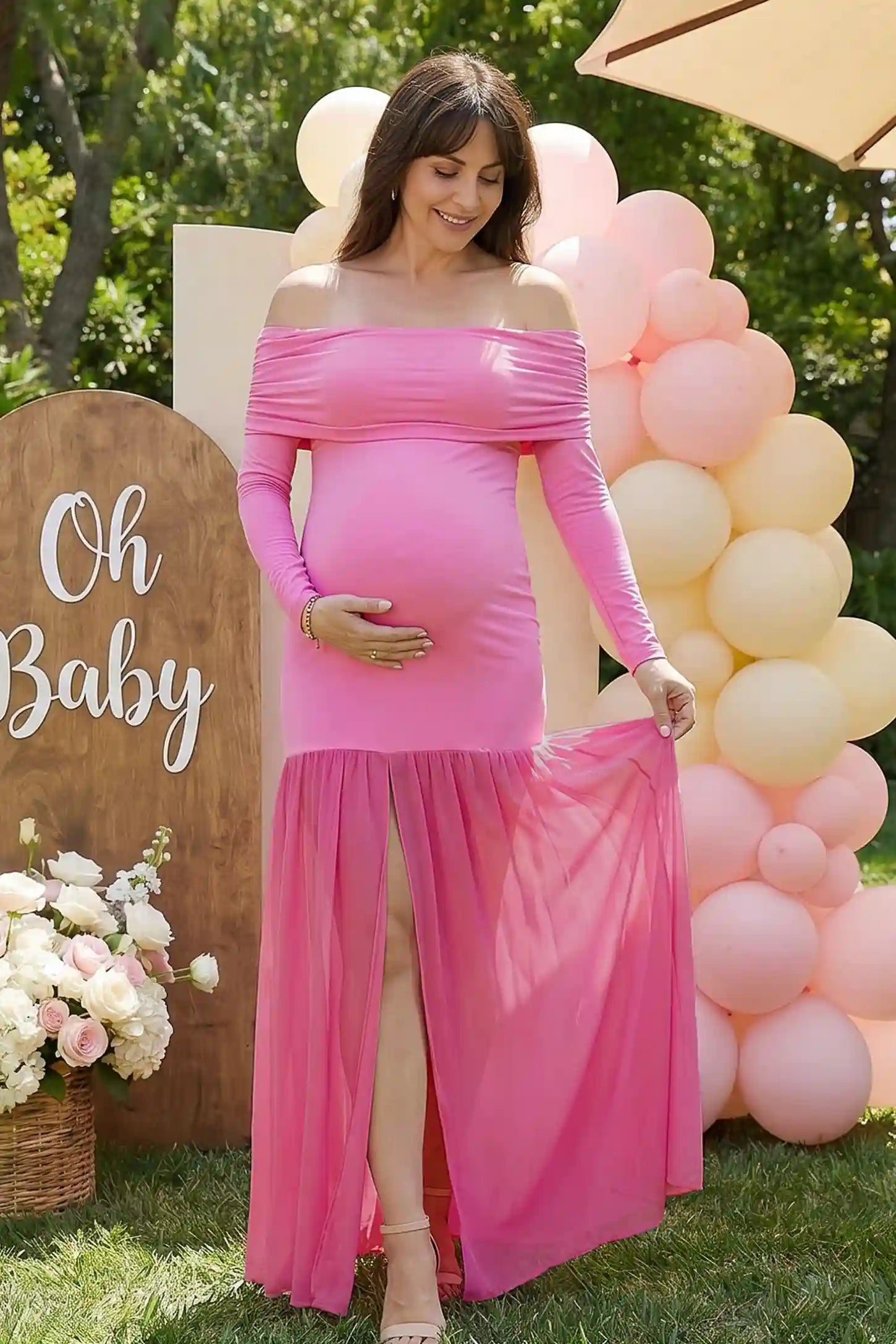 Off-shoulder side ruched mermaid maternity maxi dress in pink with off-shoulder neckline and front slit, front view on pregnant model