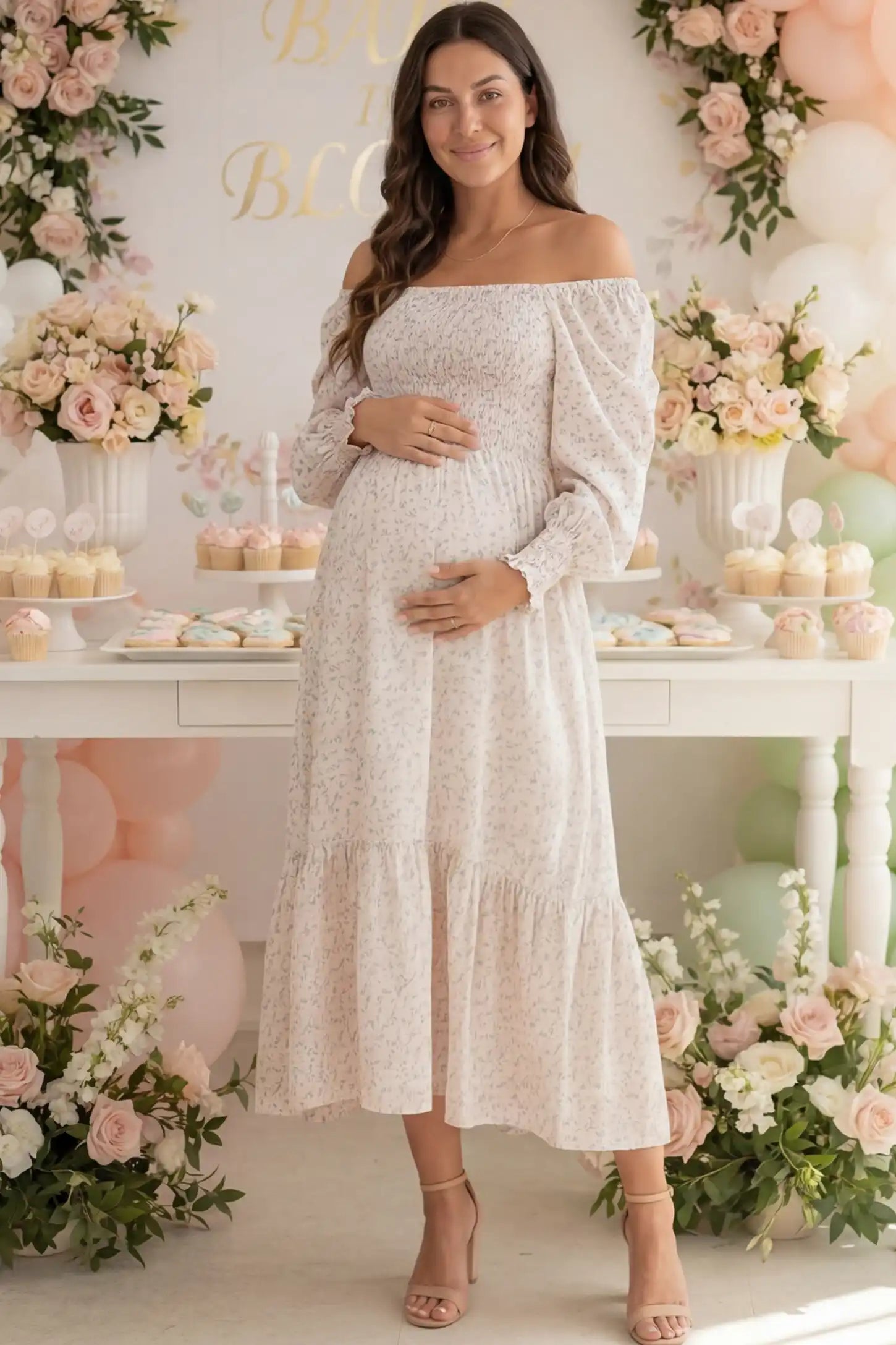 Floral Smocked Tiered Maternity Midi Dress in soft pink floral print featuring square neckline, puff sleeves, and tiered midi skirt on pregnant model.
