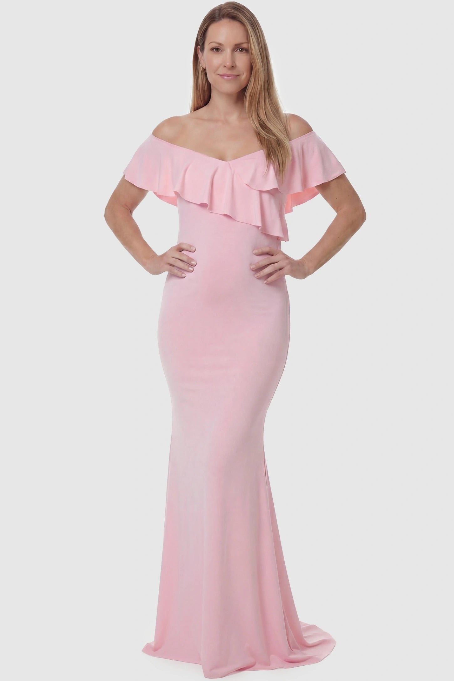 Ruffle Off-Shoulder Slim Fit Maxi Maternity Dress Ruffle off-shoulder slim fit maxi maternity dress in pink featuring curve-flattering silhouette in full body view on a postpartum model