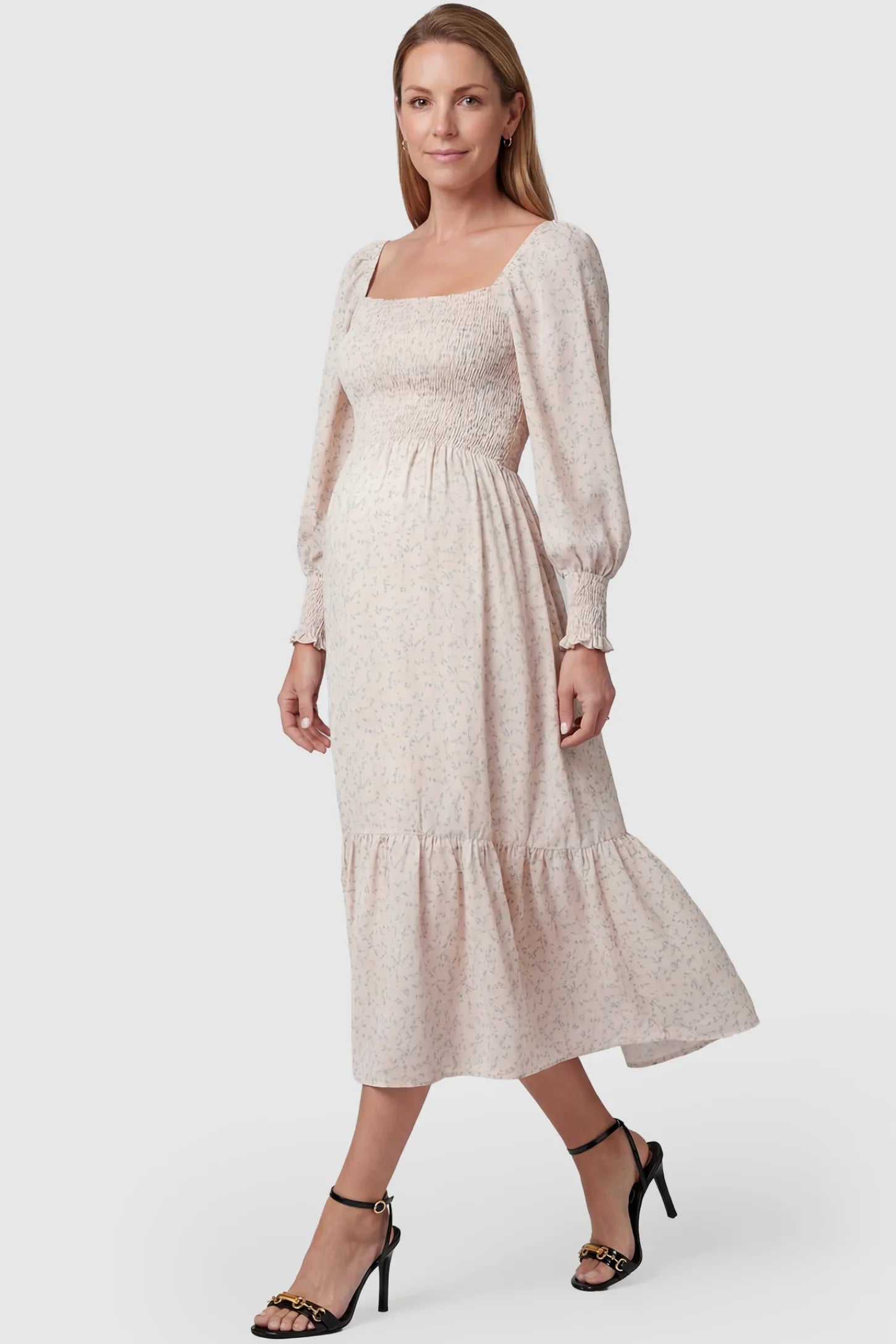 Floral Smocked Tiered Maternity Midi Dress Floral Smocked Tiered Maternity Midi Dress in soft pink floral print featuring square neckline, puff sleeves, and tiered midi skirt on non pregnant model.