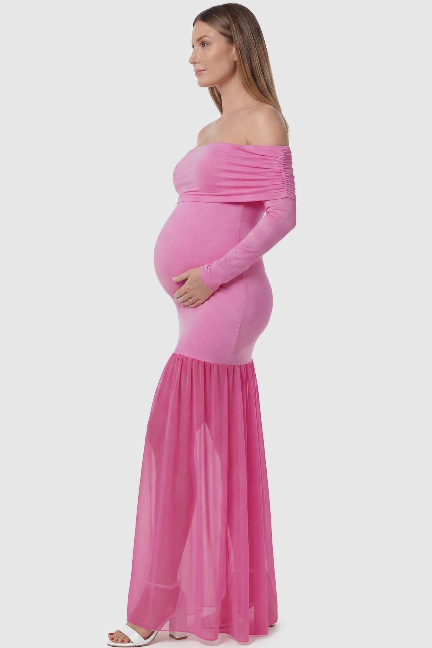 Off-Shoulder Side Ruched Mermaid Maternity Maxi Dress Off-shoulder side ruched mermaid maternity maxi dress in pink with ruched side detailing, side view on pregnant model