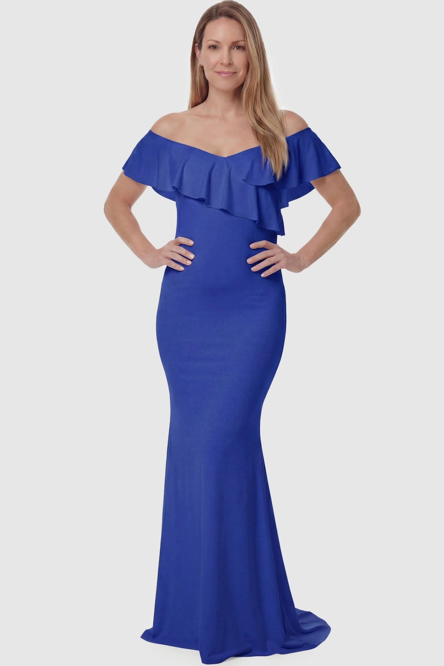 Ruffle Off-Shoulder Slim Fit Maxi Maternity Dress Ruffle off-shoulder slim fit maxi maternity dress in royal blue featuring curve-flattering silhouette in full body view on a postpartum model