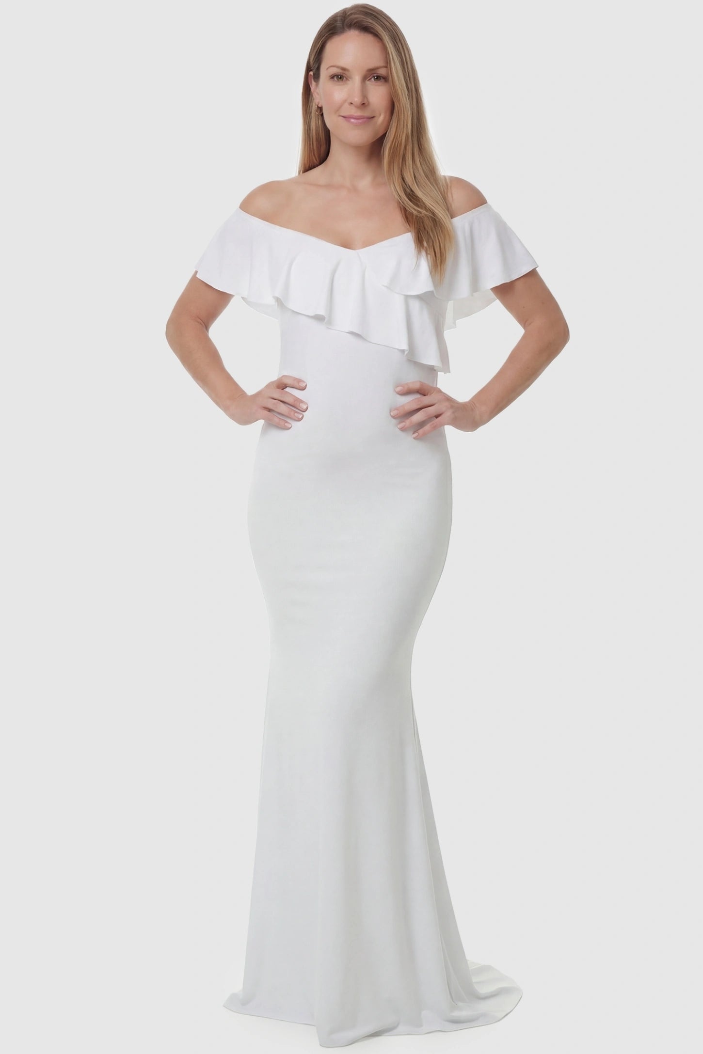 Ruffle Off-Shoulder Slim Fit Maxi Maternity Dress Ruffle off-shoulder slim fit maxi maternity dress in white featuring curve-flattering silhouette in full body view on a postpartum model