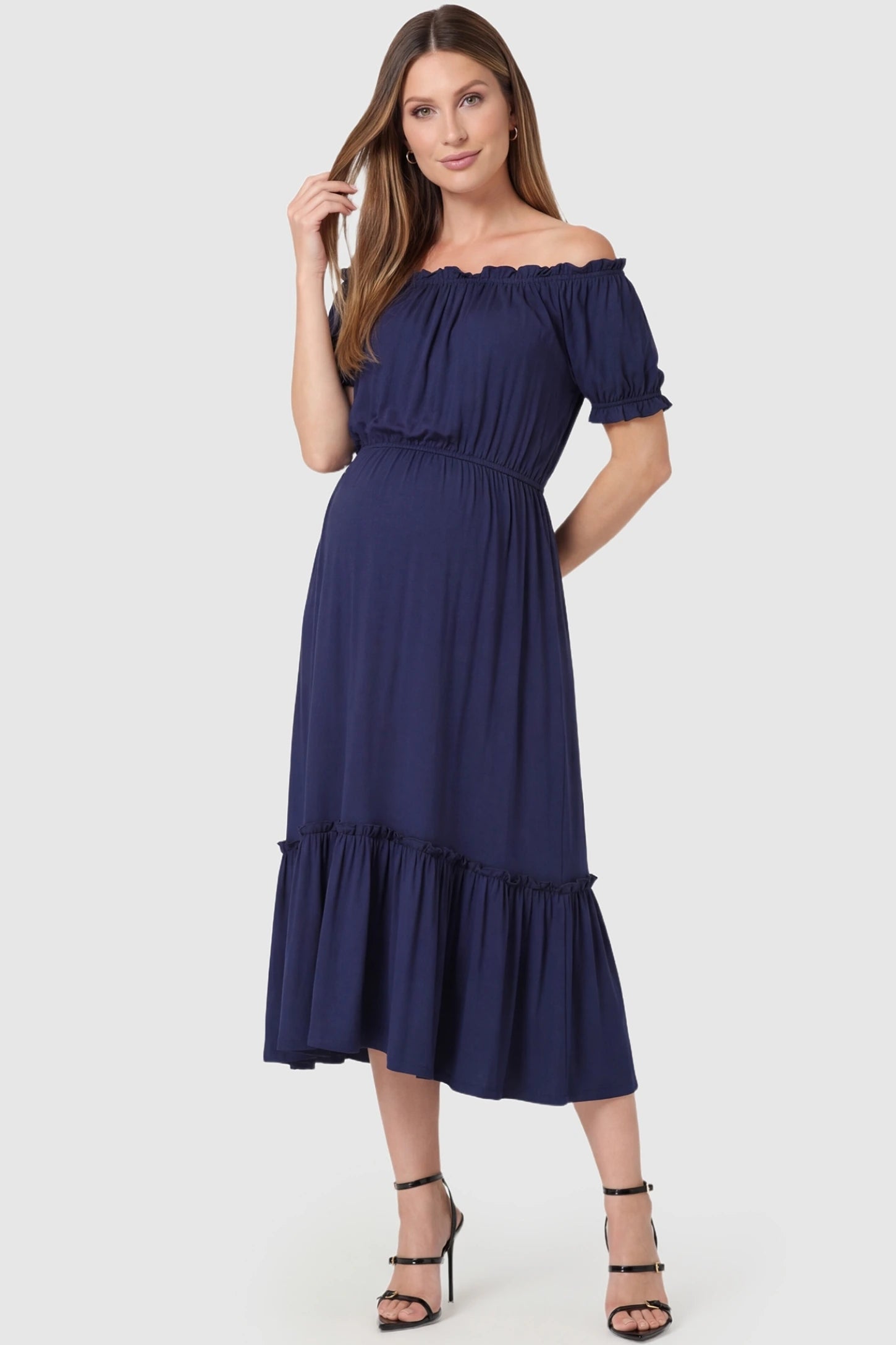 Ruffle Off-The-Shoulder Tiered Maternity Dress in Blue featuring short puff sleeves on a front-facing pregnant model.