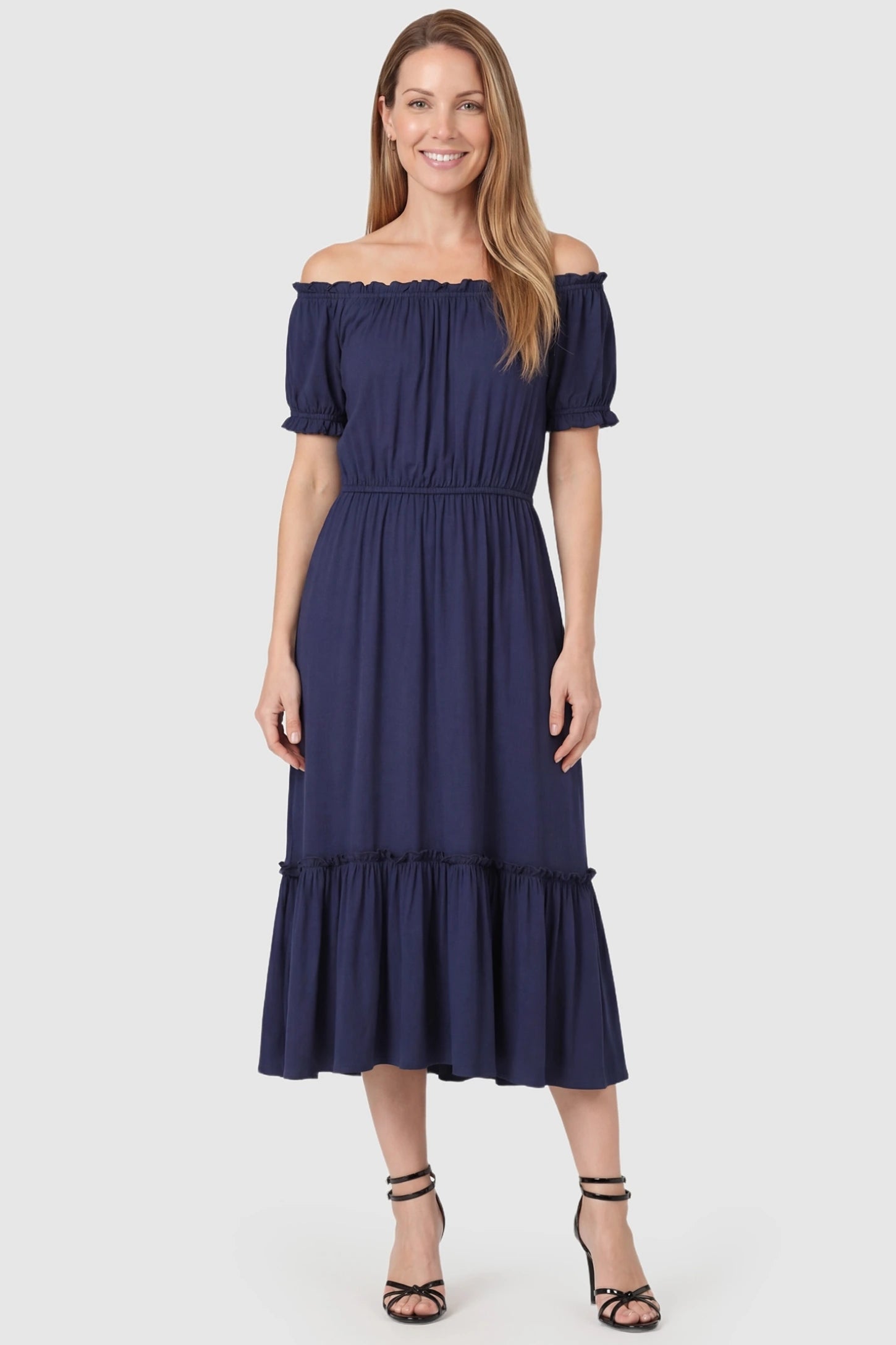 Ruffle Off-The-Shoulder Tiered Maternity Dress Ruffle Off-The-Shoulder Tiered Maternity Dress in Blue featuring adaptive modal fabric on a front-facing postpartum model.