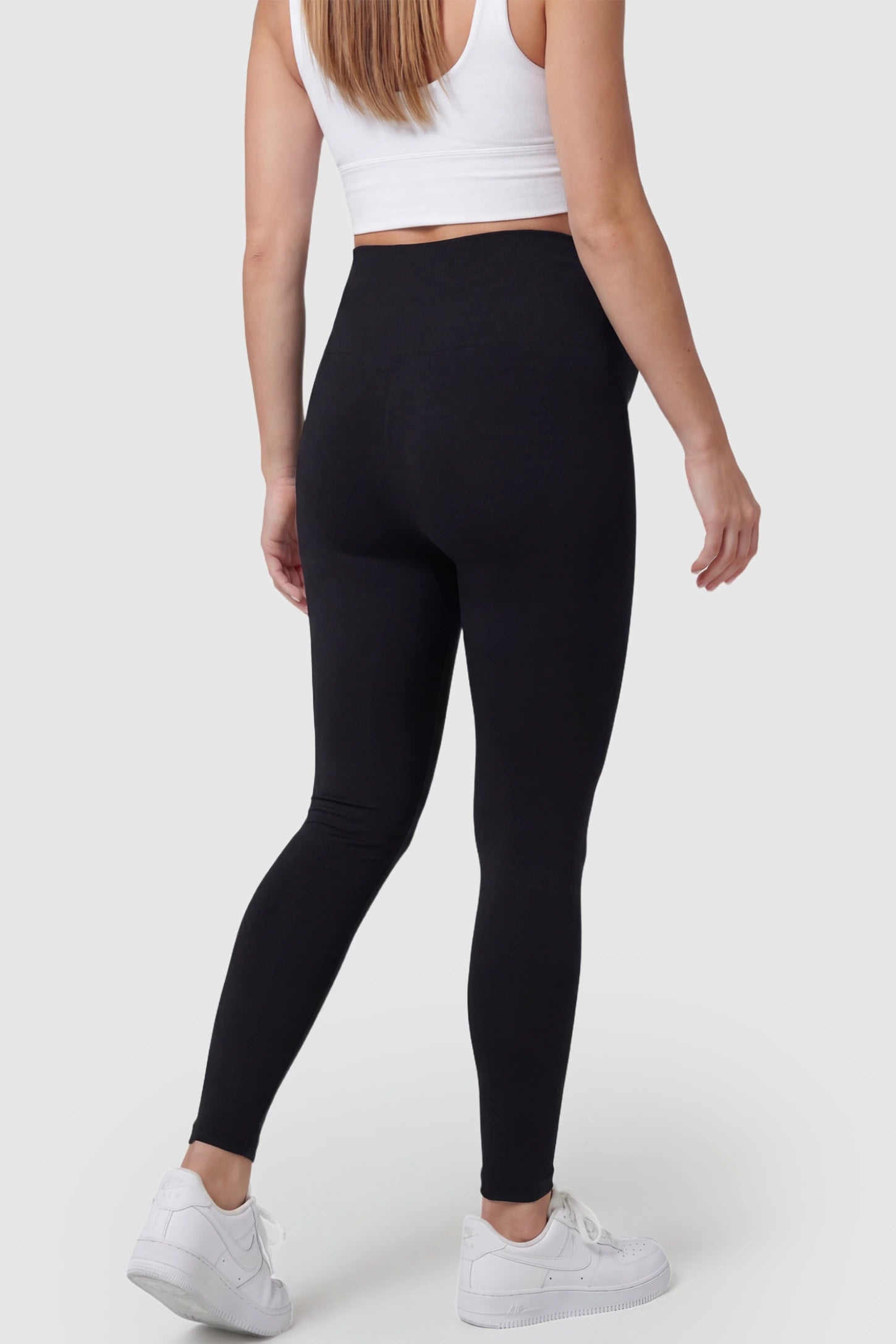 Over-The-Belly Full-Length Maternity Yoga Leggings Over-The-Belly Full-Length Maternity Yoga Leggings in black featuring contouring bodycon fit and supportive full panel on pregnant model.