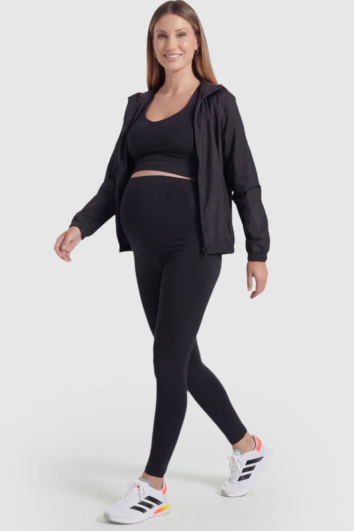 Over-The-Belly Full-Length Maternity Yoga Leggings Over-The-Belly Full-Length Maternity Yoga Leggings in black featuring contouring bodycon fit and supportive full panel on pregnant model.