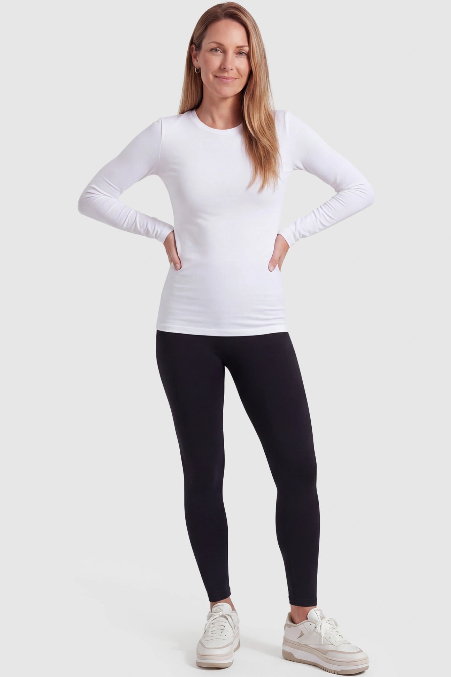 Over-The-Belly Full-Length Maternity Yoga Leggings Over-The-Belly Full-Length Maternity Yoga Leggings in black featuring contouring bodycon fit and supportive full panel on postpartum model front view.