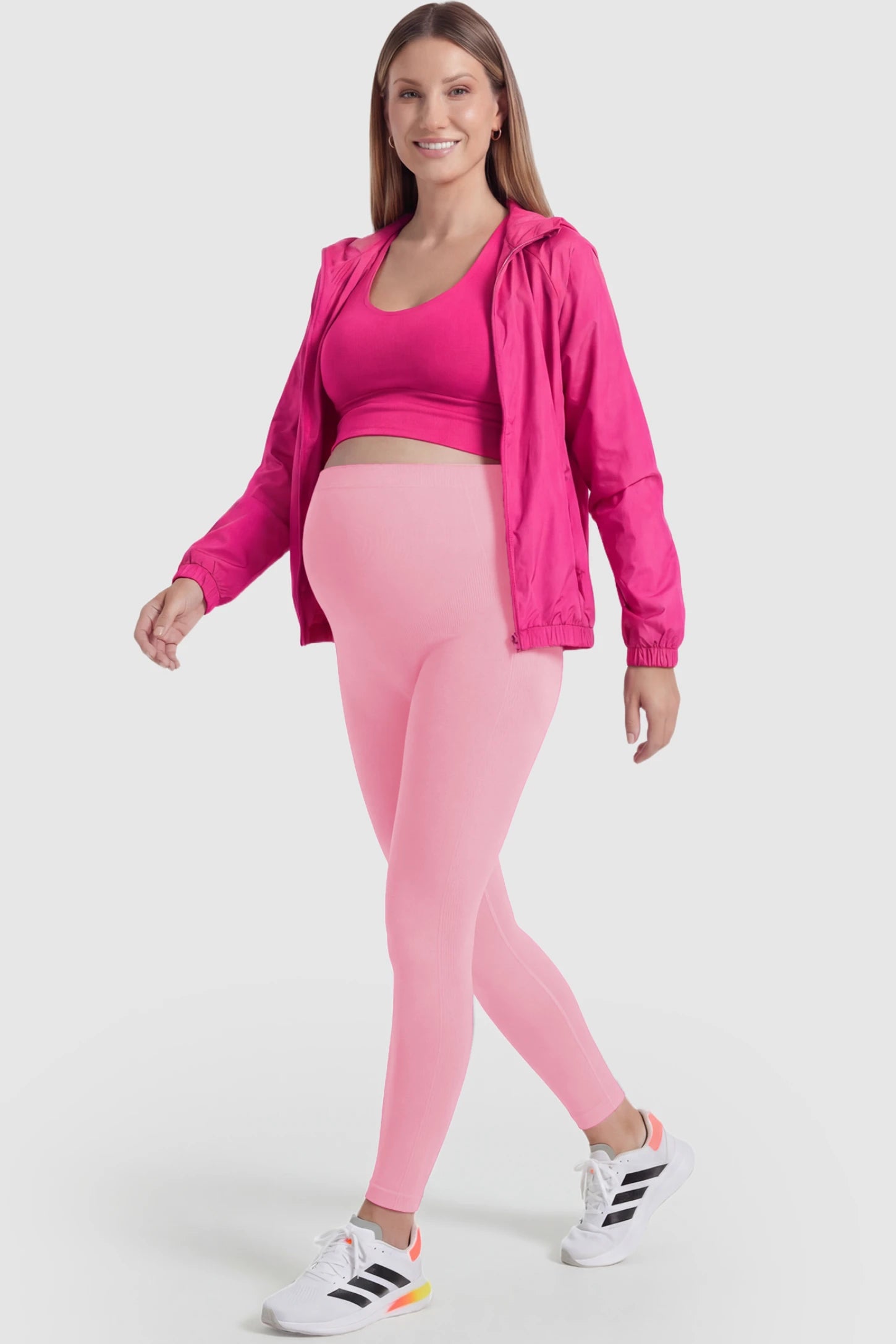 Over-The-Belly Full-Length Maternity Yoga Leggings Over-The-Belly Full-Length Maternity Yoga Leggings in coral pink featuring contouring bodycon fit and supportive full panel on pregnant model.