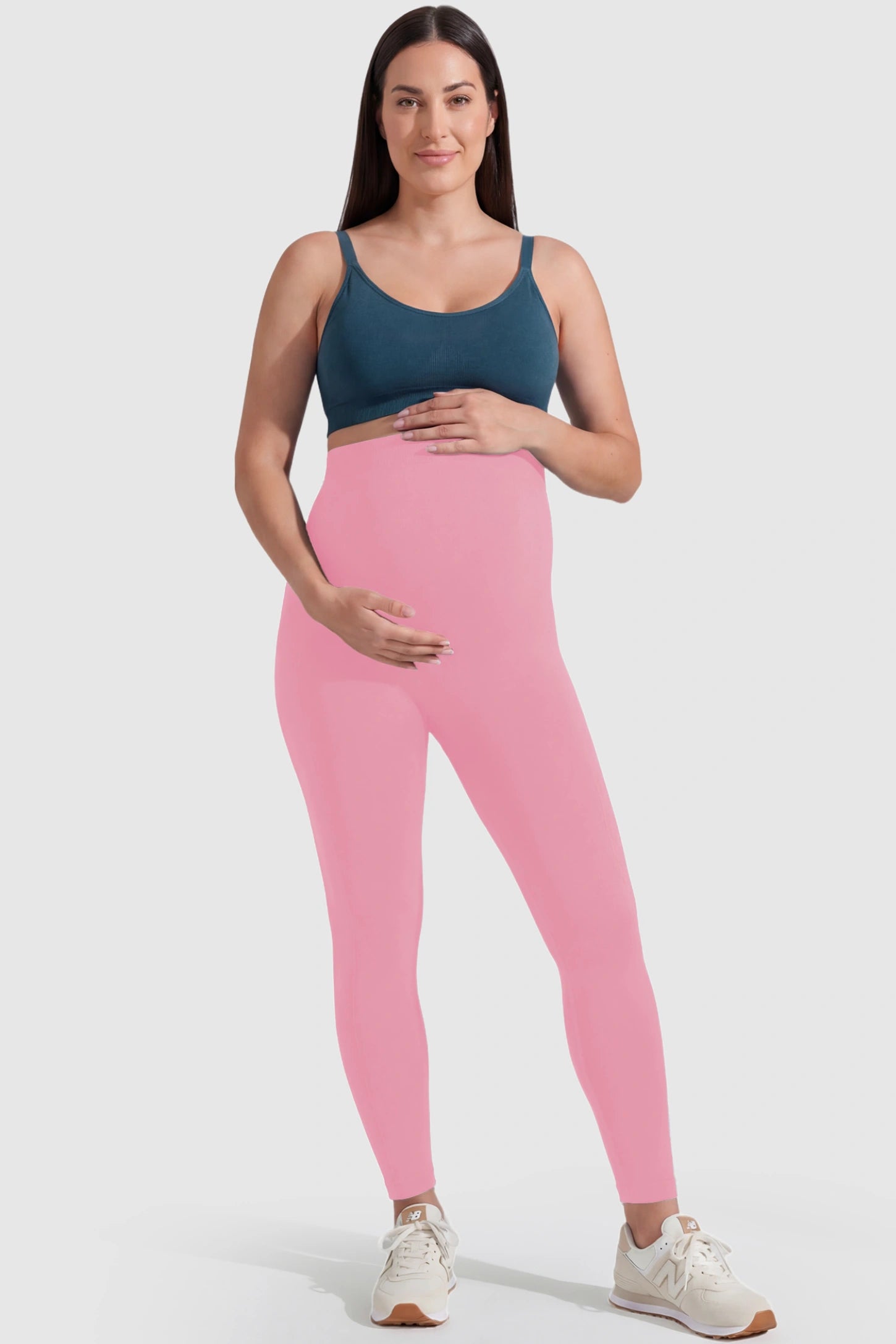 Over-The-Belly Full-Length Maternity Yoga Leggings Over-The-Belly Full-Length Maternity Yoga Leggings in coral pink featuring contouring bodycon fit and supportive full panel on plus size pregnant model.