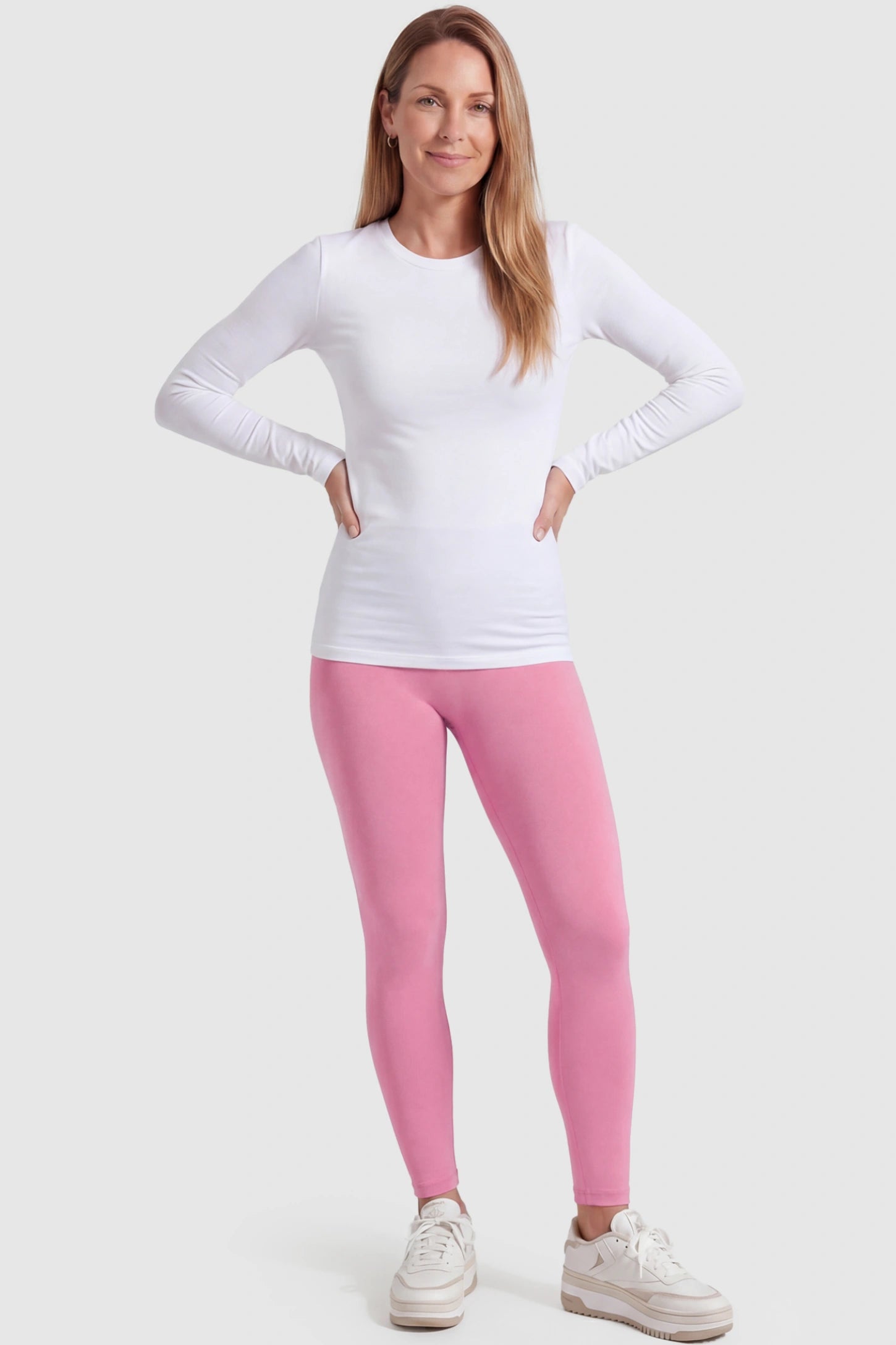 Over-The-Belly Full-Length Maternity Yoga Leggings Over-The-Belly Full-Length Maternity Yoga Leggings in coral pink featuring contouring bodycon fit and supportive full panel on postpartum model front view.