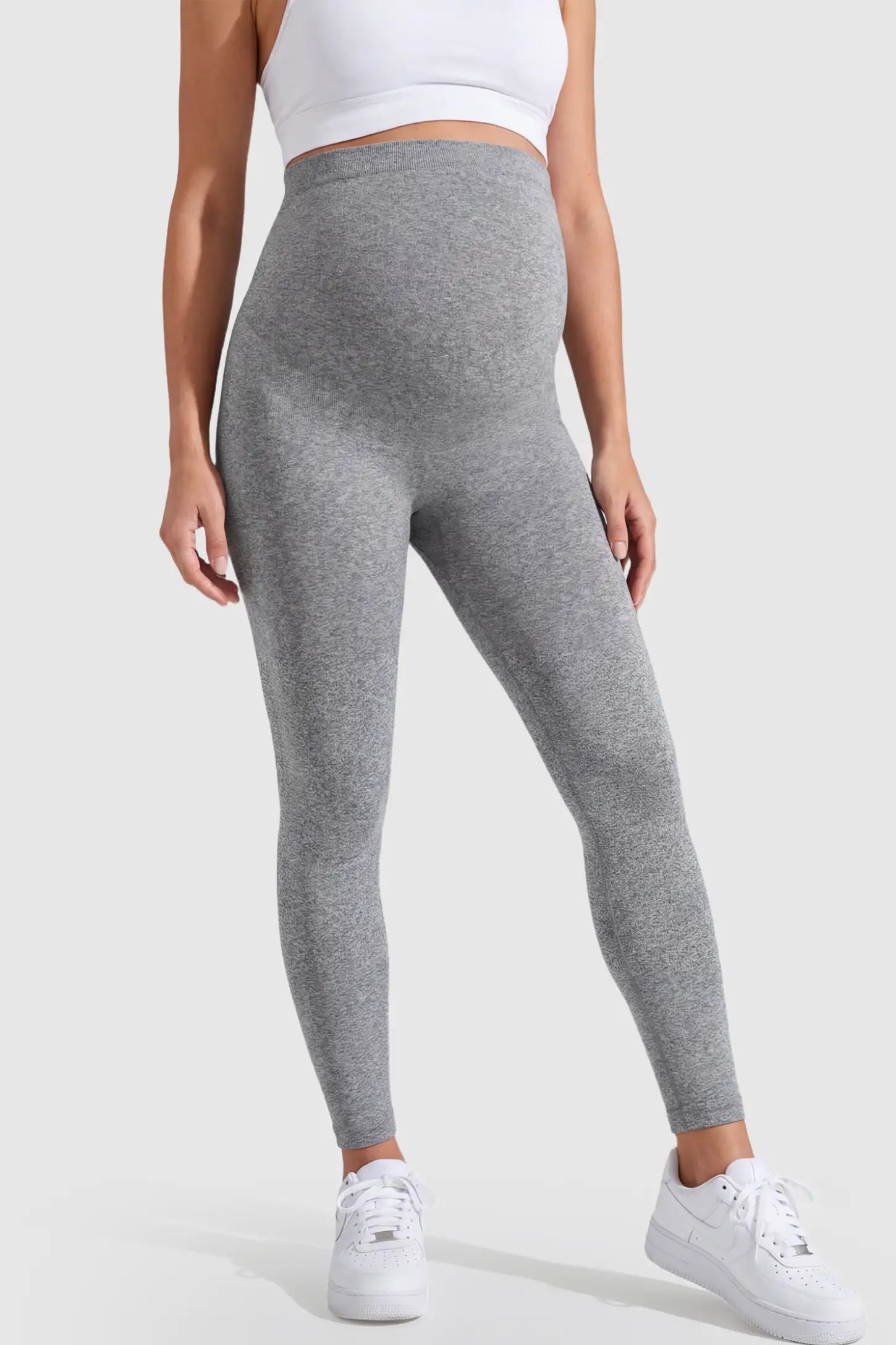 Over-The-Belly Full-Length Maternity Yoga Leggings in gray featuring contouring bodycon fit and supportive full panel on pregnant model.