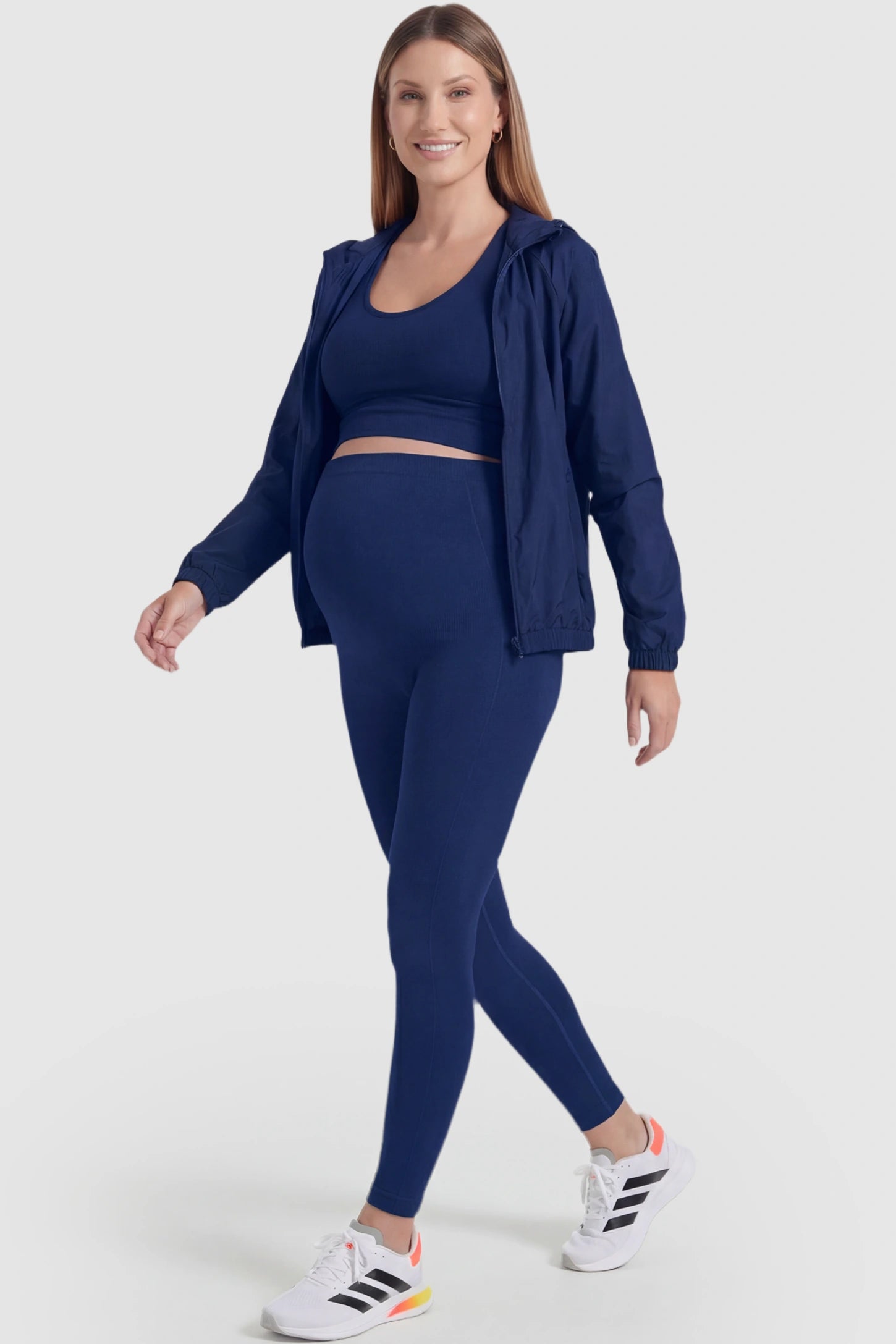 Over-The-Belly Full-Length Maternity Yoga Leggings Over-The-Belly Full-Length Maternity Yoga Leggings in navy blue featuring contouring bodycon fit and supportive full panel on pregnant model.