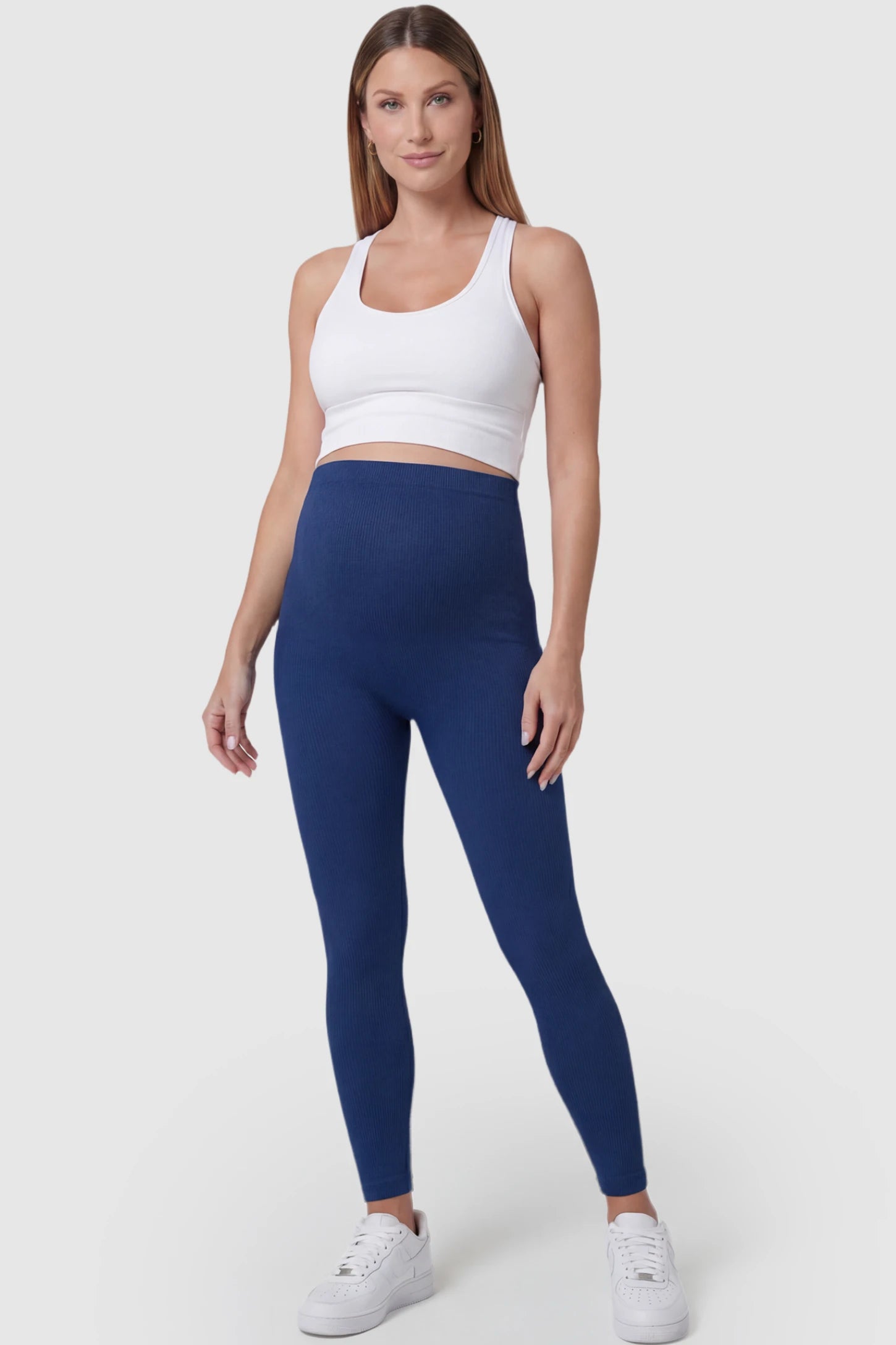 Over-The-Belly Full-Length Maternity Yoga Leggings Over-The-Belly Full-Length Maternity Yoga Leggings in navy blue featuring contouring bodycon fit and supportive full panel on pregnant model.