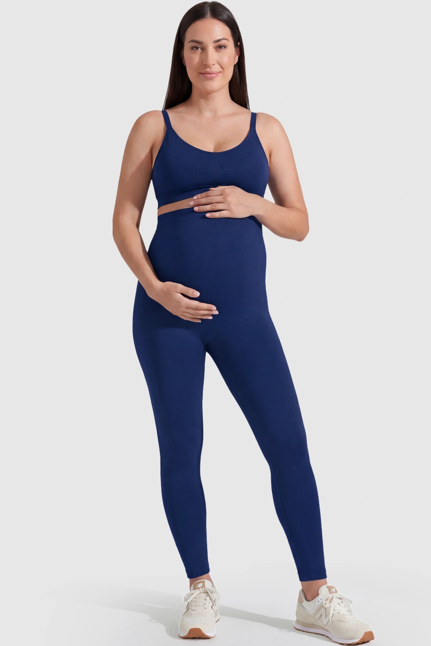 Over-The-Belly Full-Length Maternity Yoga Leggings Over-The-Belly Full-Length Maternity Yoga Leggings in navy blue featuring contouring bodycon fit and supportive full panel on plus size pregnant model.