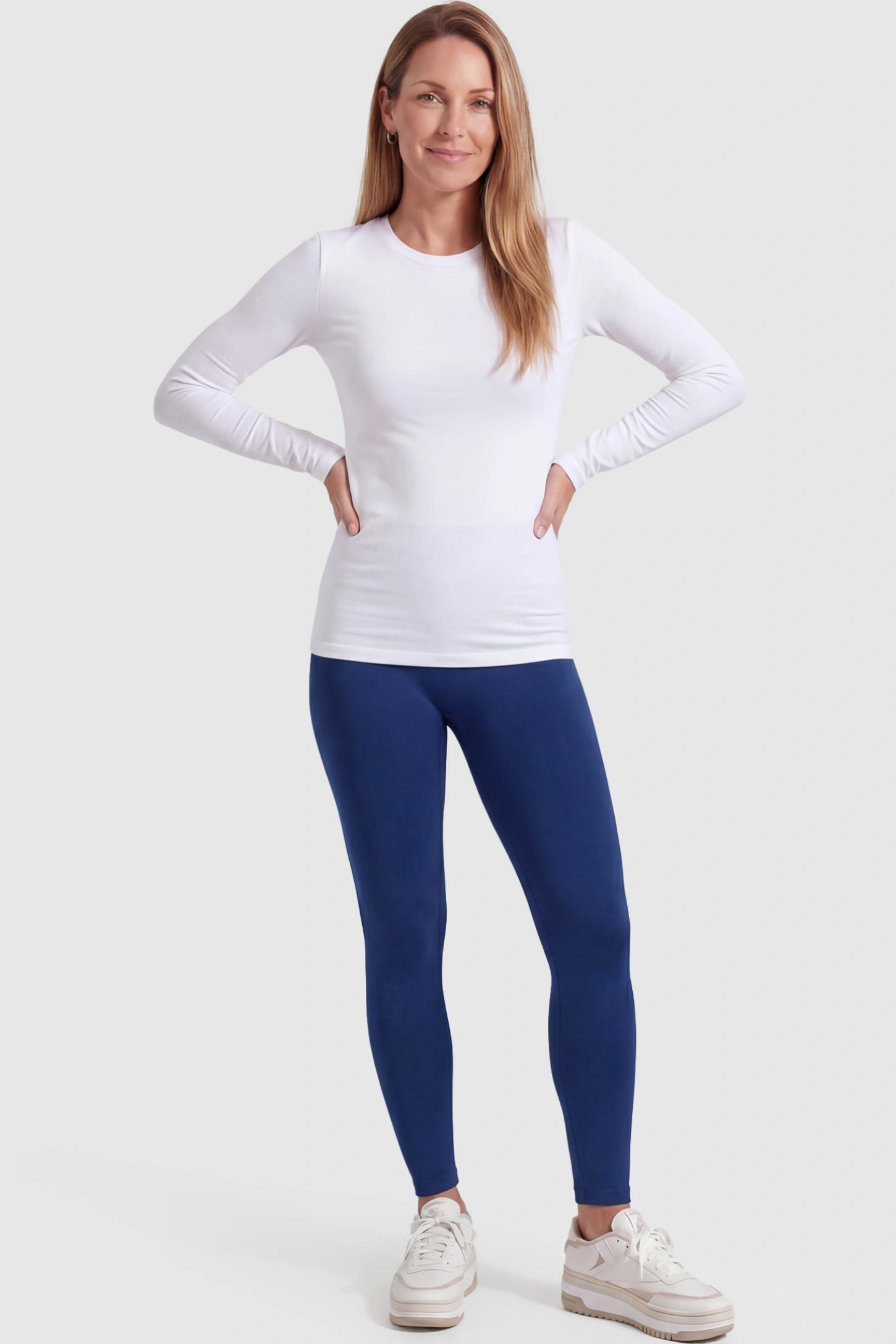 Over-The-Belly Full-Length Maternity Yoga Leggings Over-The-Belly Full-Length Maternity Yoga Leggings in navy blue featuring contouring bodycon fit and supportive full panel on postpartum model front view.