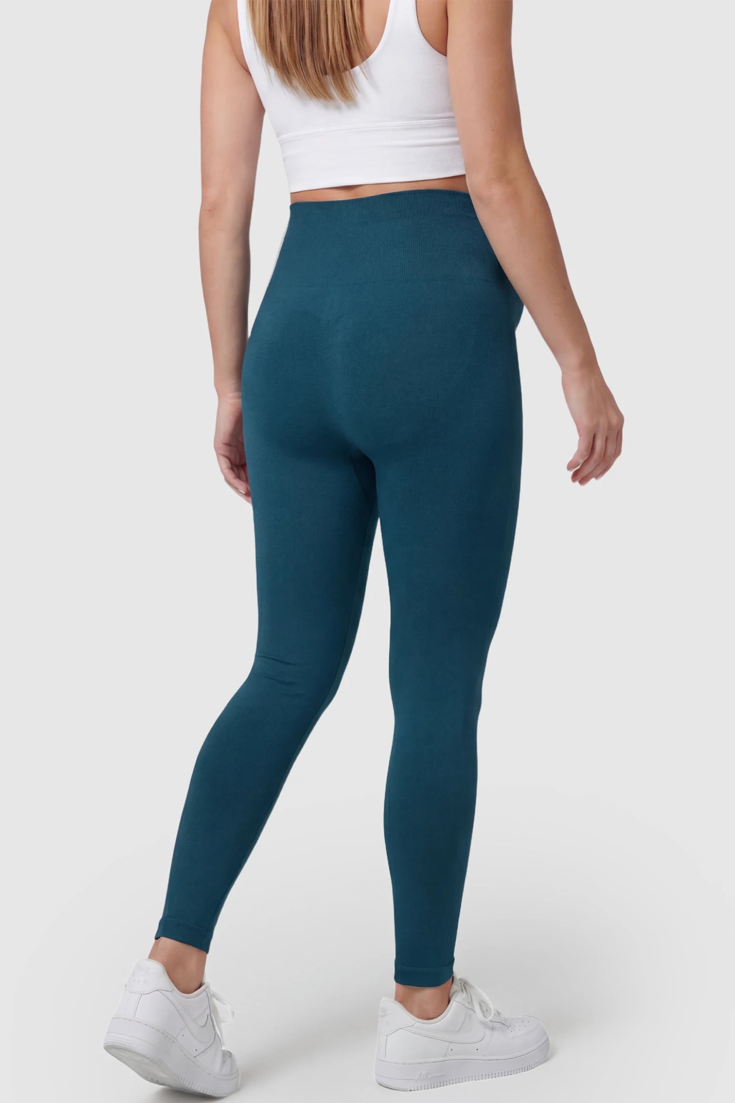 Over-The-Belly Full-Length Maternity Yoga Leggings Over-The-Belly Full-Length Maternity Yoga Leggings in teal featuring contouring bodycon fit and supportive full panel on pregnant model.
