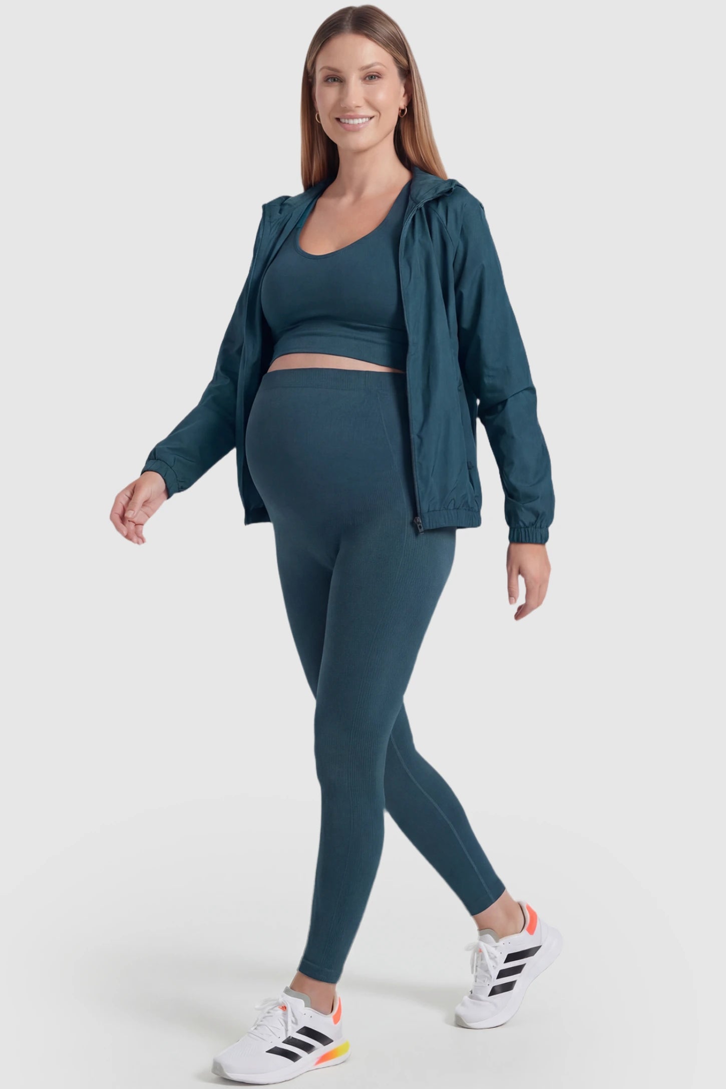 Over-The-Belly Full-Length Maternity Yoga Leggings Over-The-Belly Full-Length Maternity Yoga Leggings in teal featuring contouring bodycon fit and supportive full panel on pregnant model.