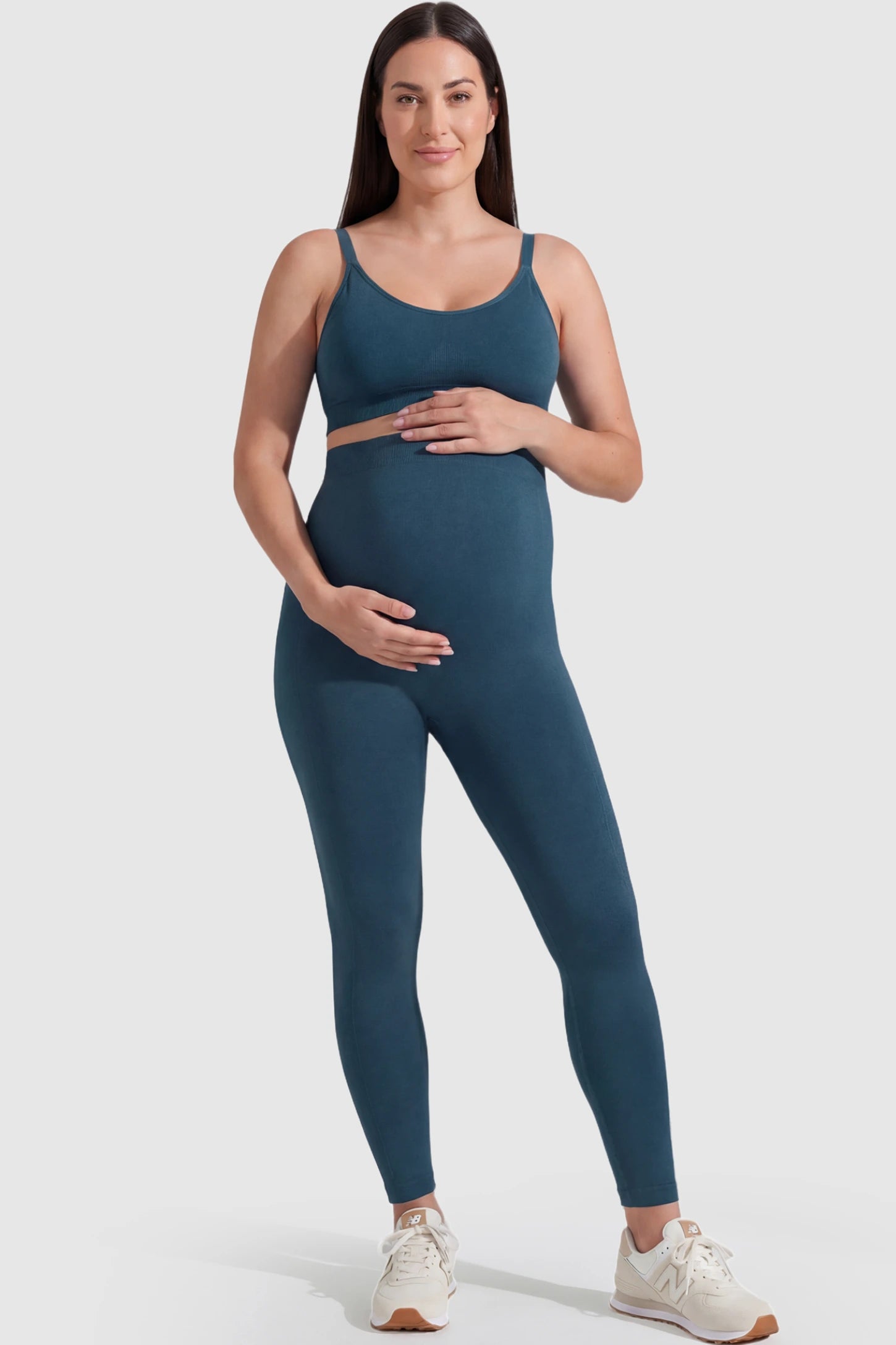 Over-The-Belly Full-Length Maternity Yoga Leggings Over-The-Belly Full-Length Maternity Yoga Leggings in teal featuring contouring bodycon fit and supportive full panel on plus size pregnant model.