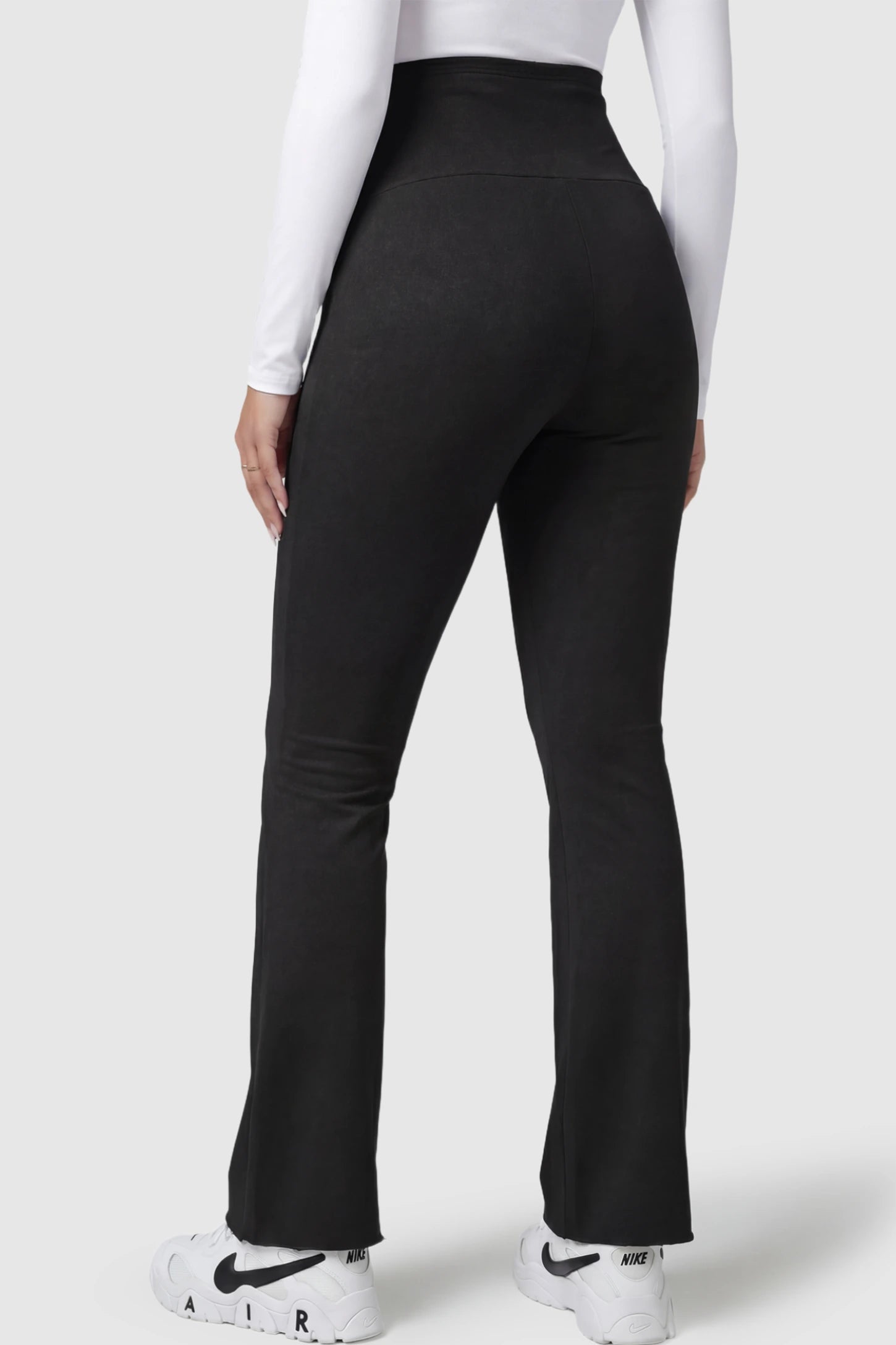 Full Panel Pocketed Flare Leg Maternity Leggings Full Panel Pocketed Flare Leg Maternity Leggings in Black on a pregnant model.