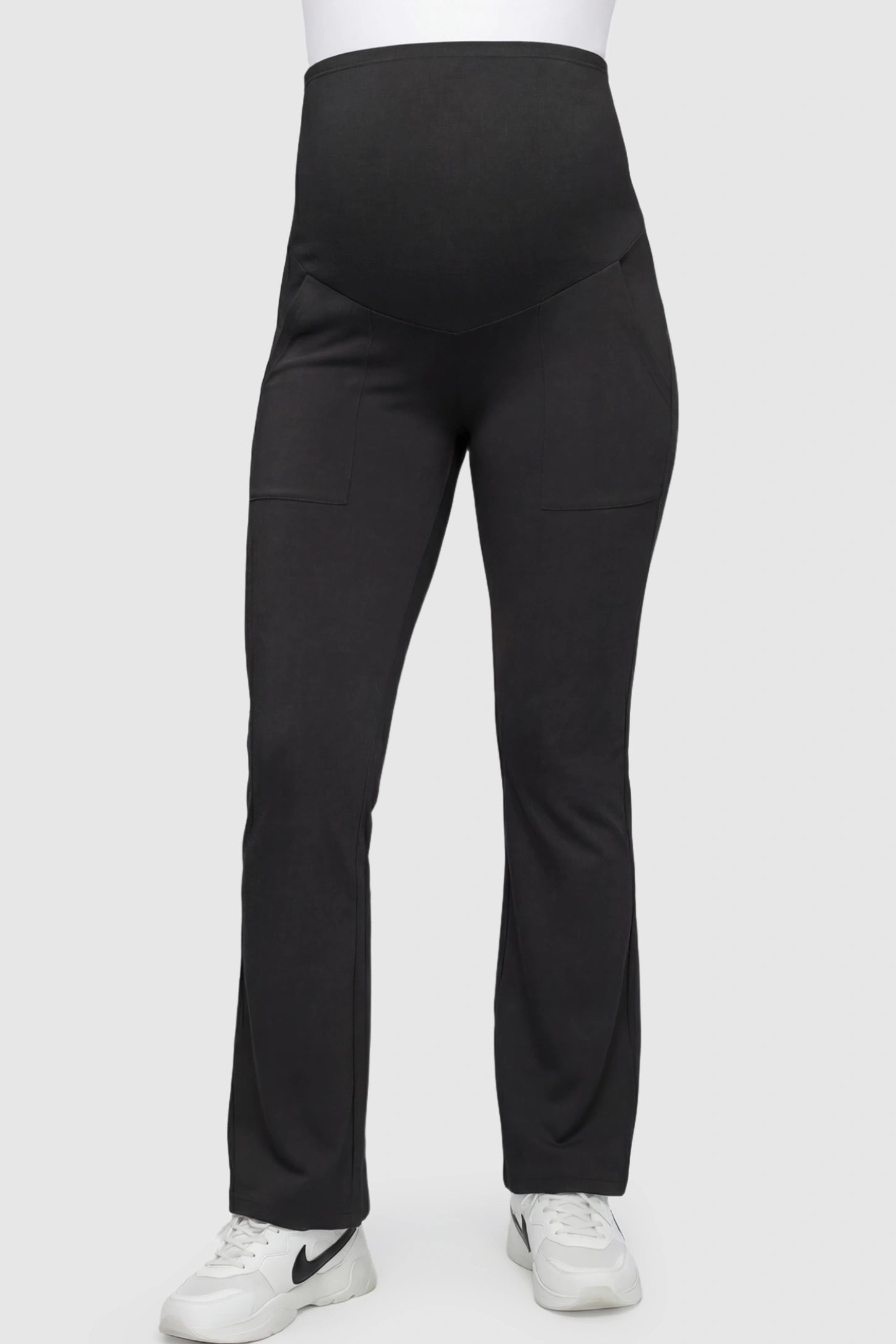 Full Panel Pocketed Flare Leg Maternity Leggings in Black featuring a ribbed over-the-bump panel on a pregnant model.