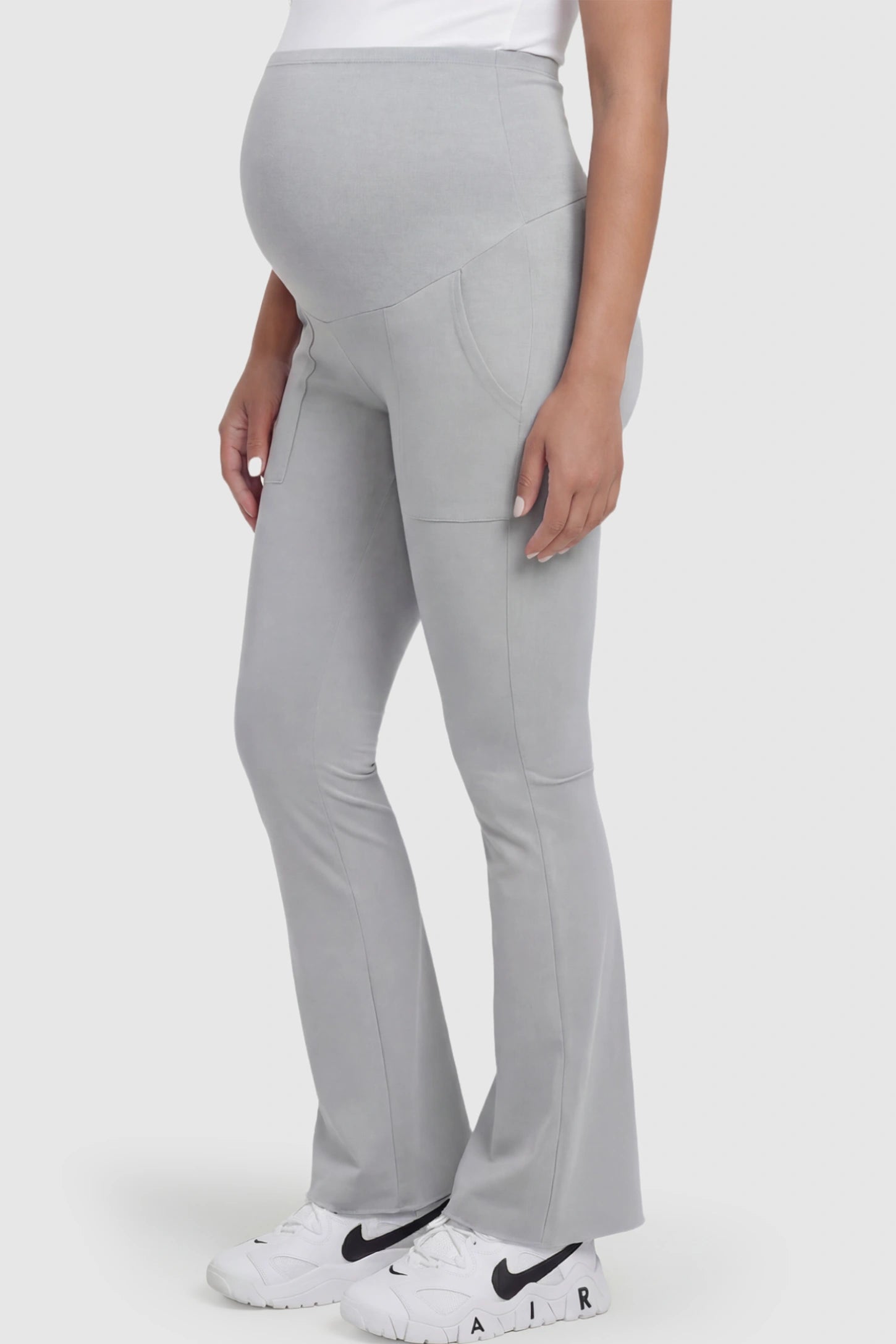 Full Panel Pocketed Flare Leg Maternity Leggings Full Panel Pocketed Flare Leg Maternity Leggings in Gray featuring a ribbed over-the-bump panel on a pregnant model.
